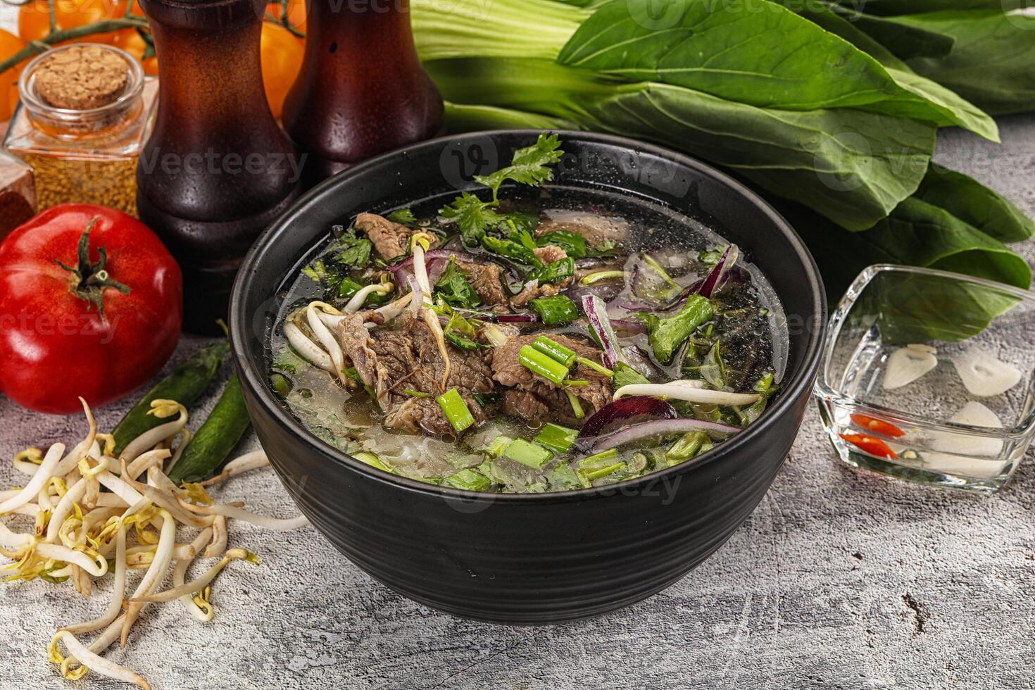 Vietnamese cuisine - Pho Bo soup with beef photo