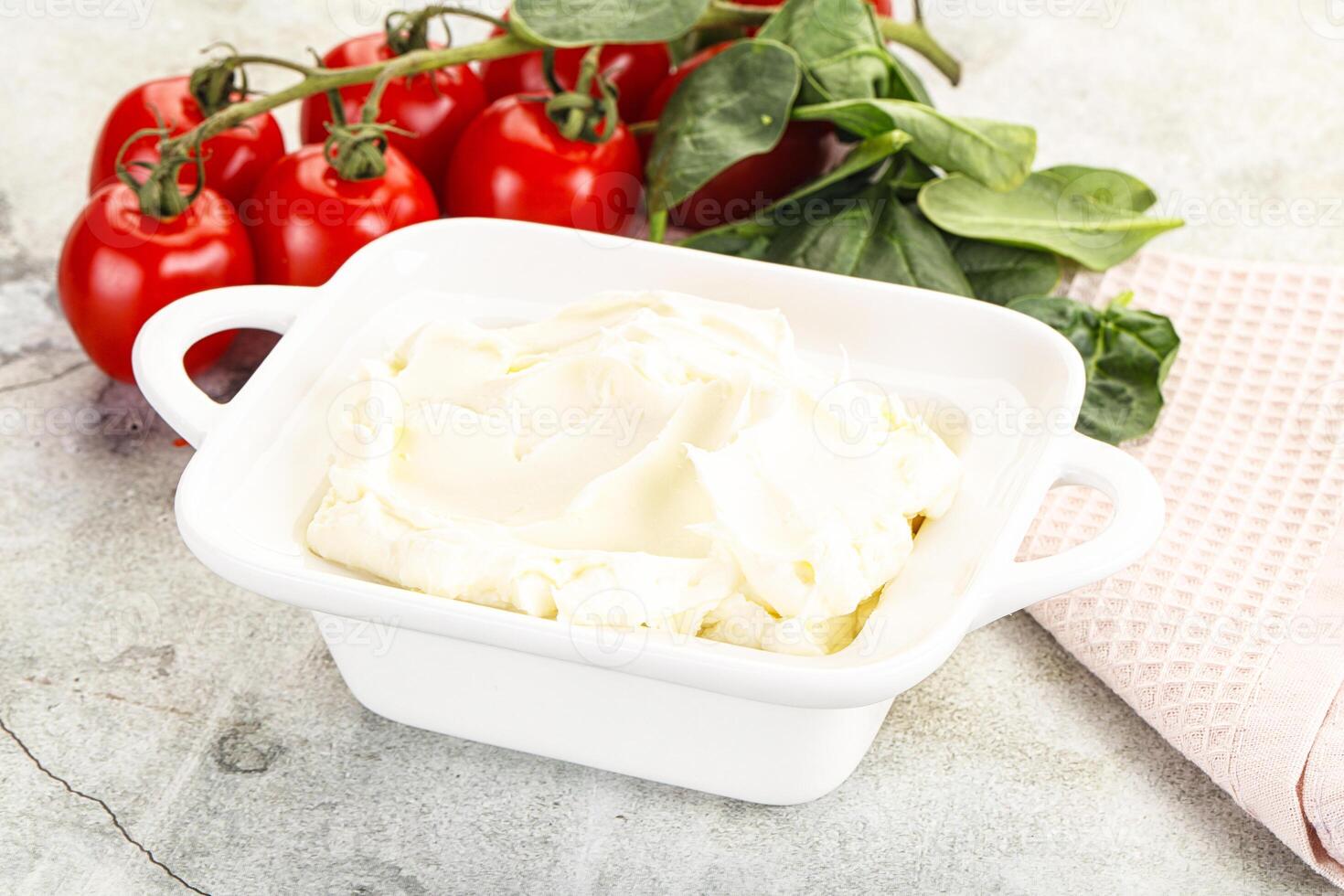 Soft cream cheese in the bowl photo