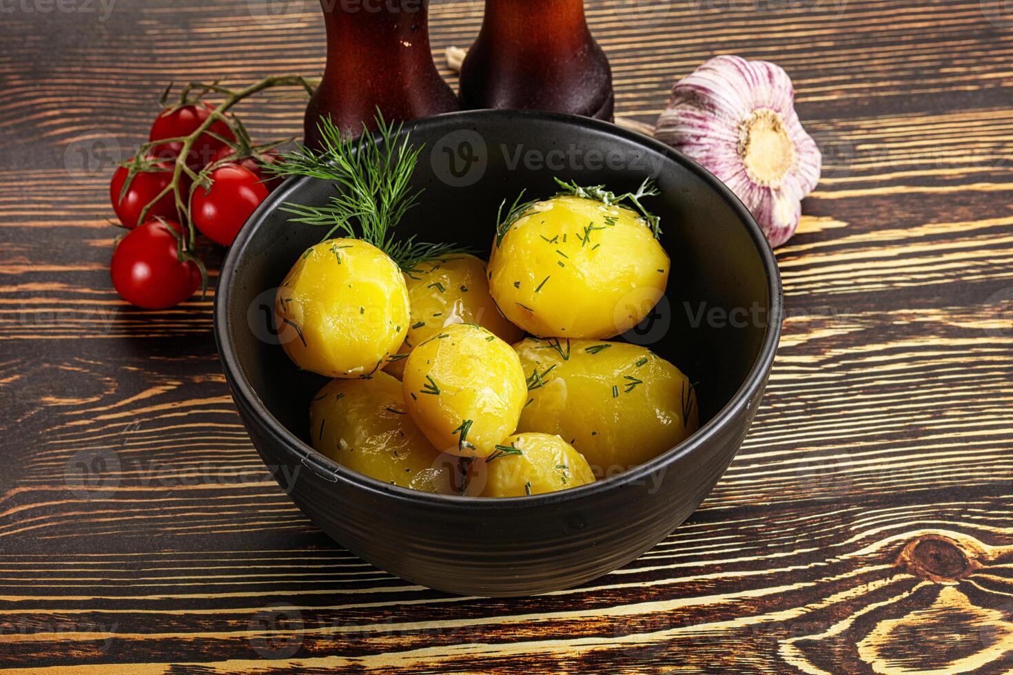 Boiled potato with oil and dill photo