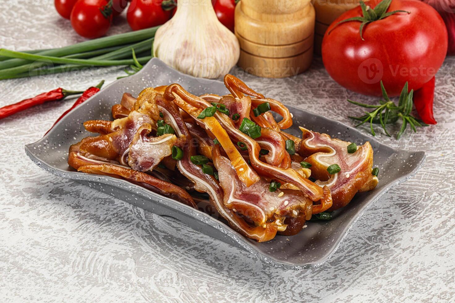 Sliced smoked pork ear snack photo