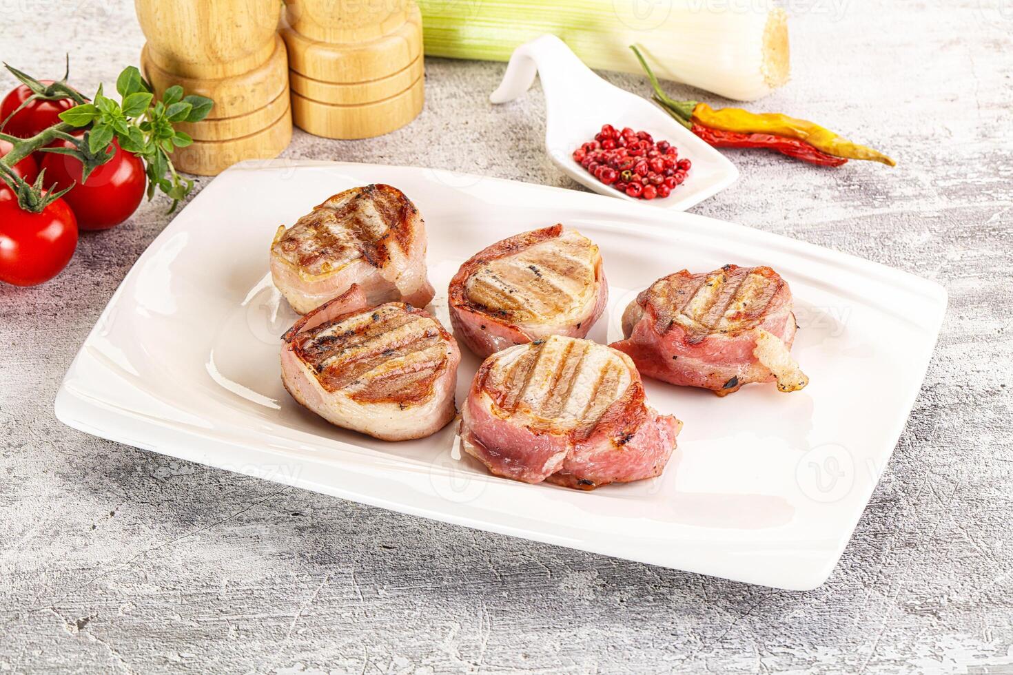 Grilled pork tenderloin with bacon photo