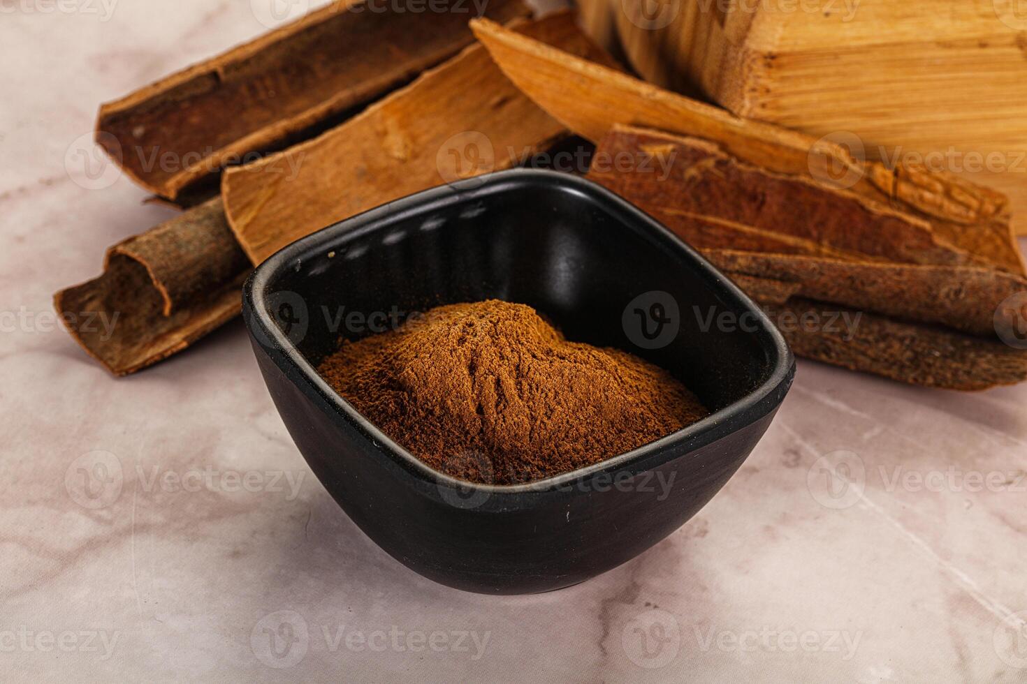 Natural Cinnamon powder with sticks photo