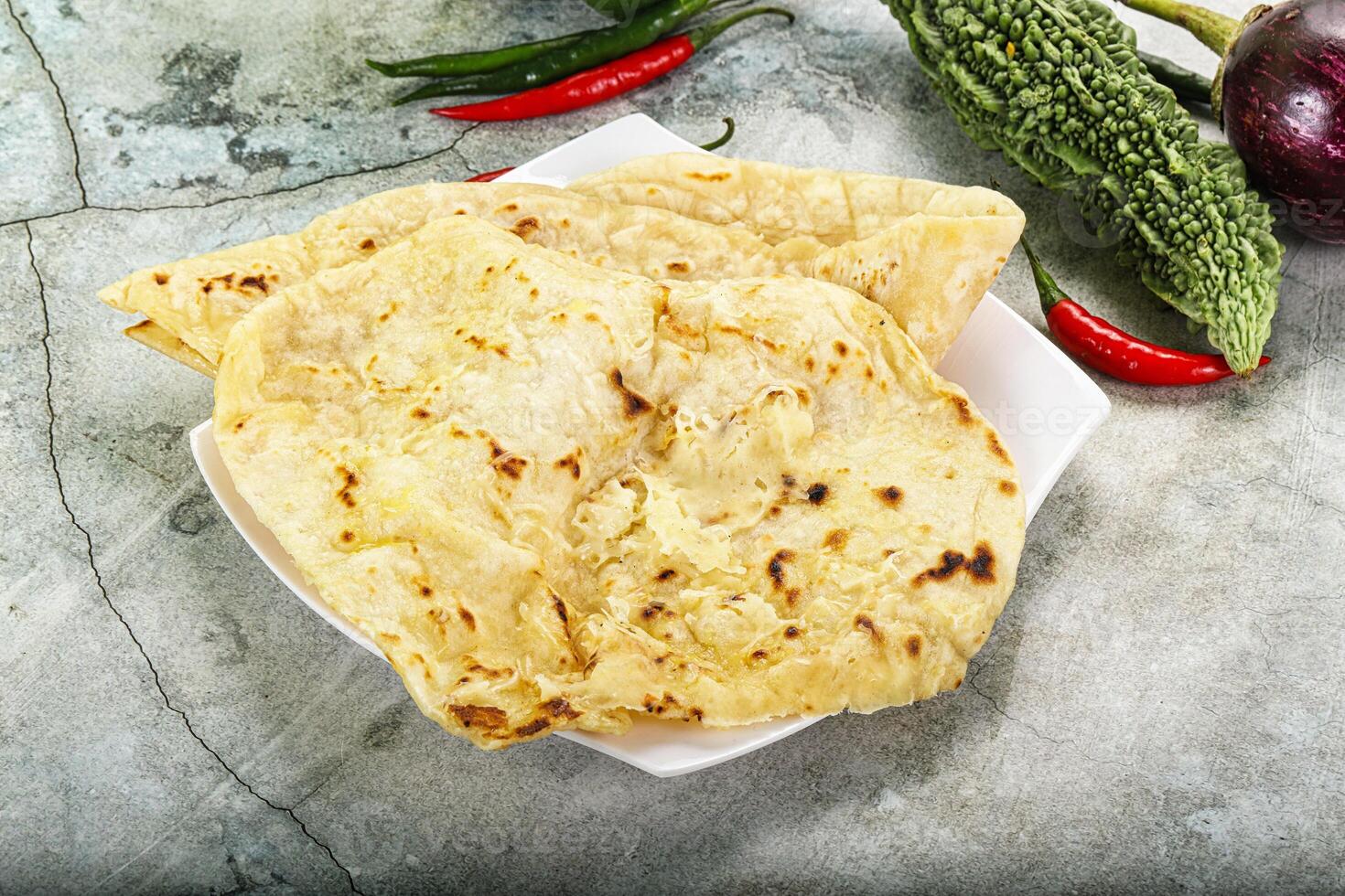 Indian tandori bread - naan with cheese photo