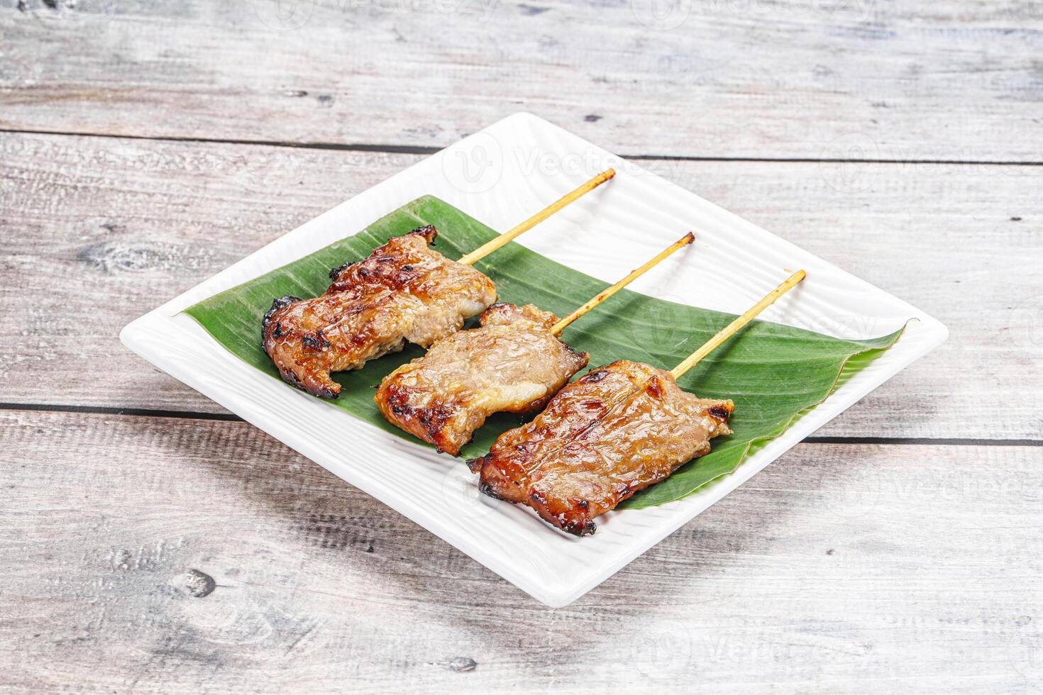 Thai cuisine - grilled pork skewer photo