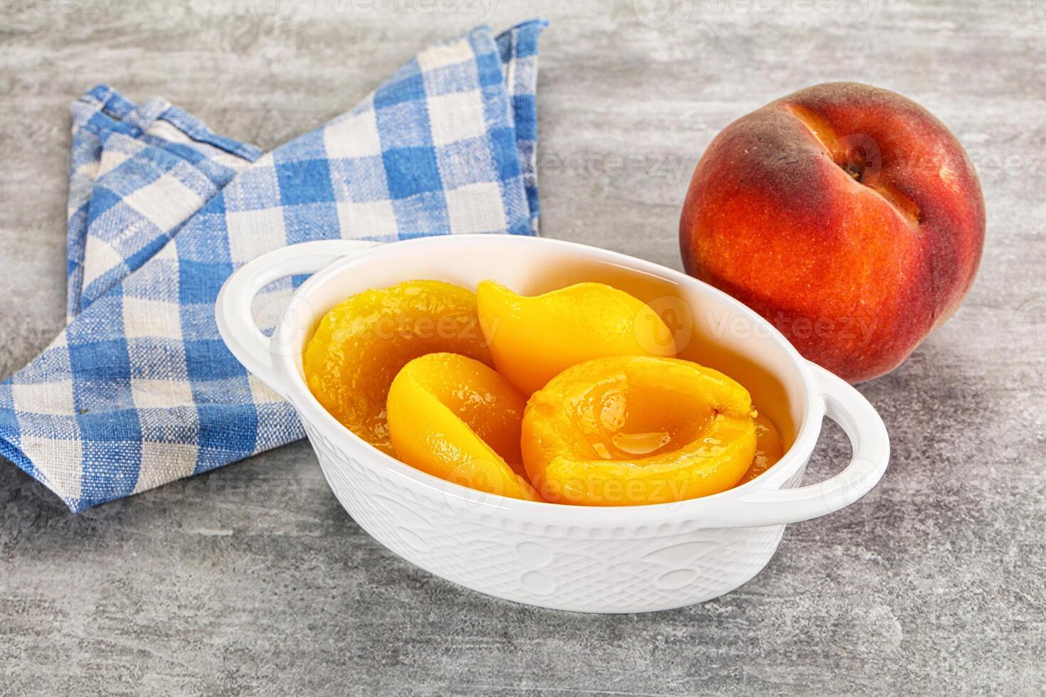 Ripe sweet and juicy canned peach photo