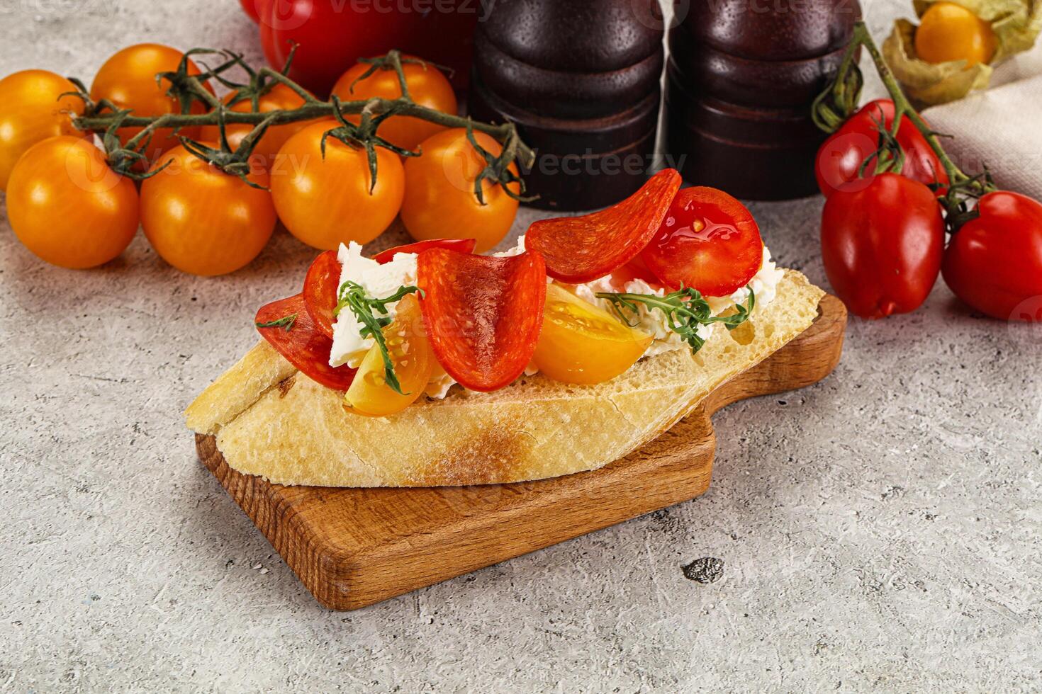 Bruschetta tapas with chorizo and tomato photo