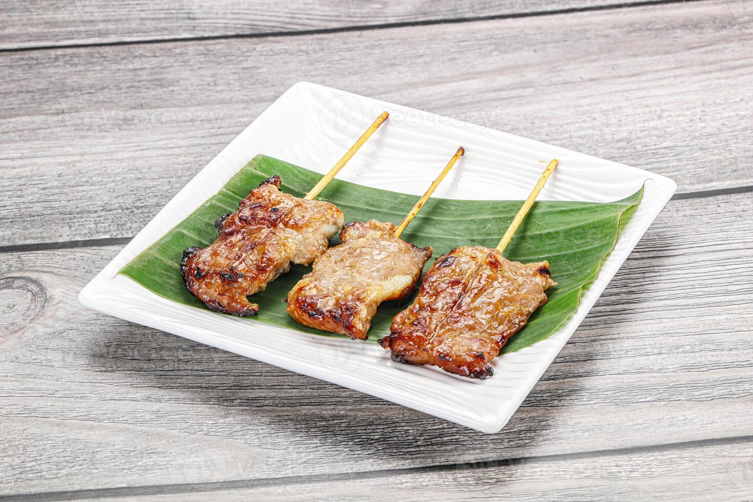 Thai cuisine - grilled pork skewer photo