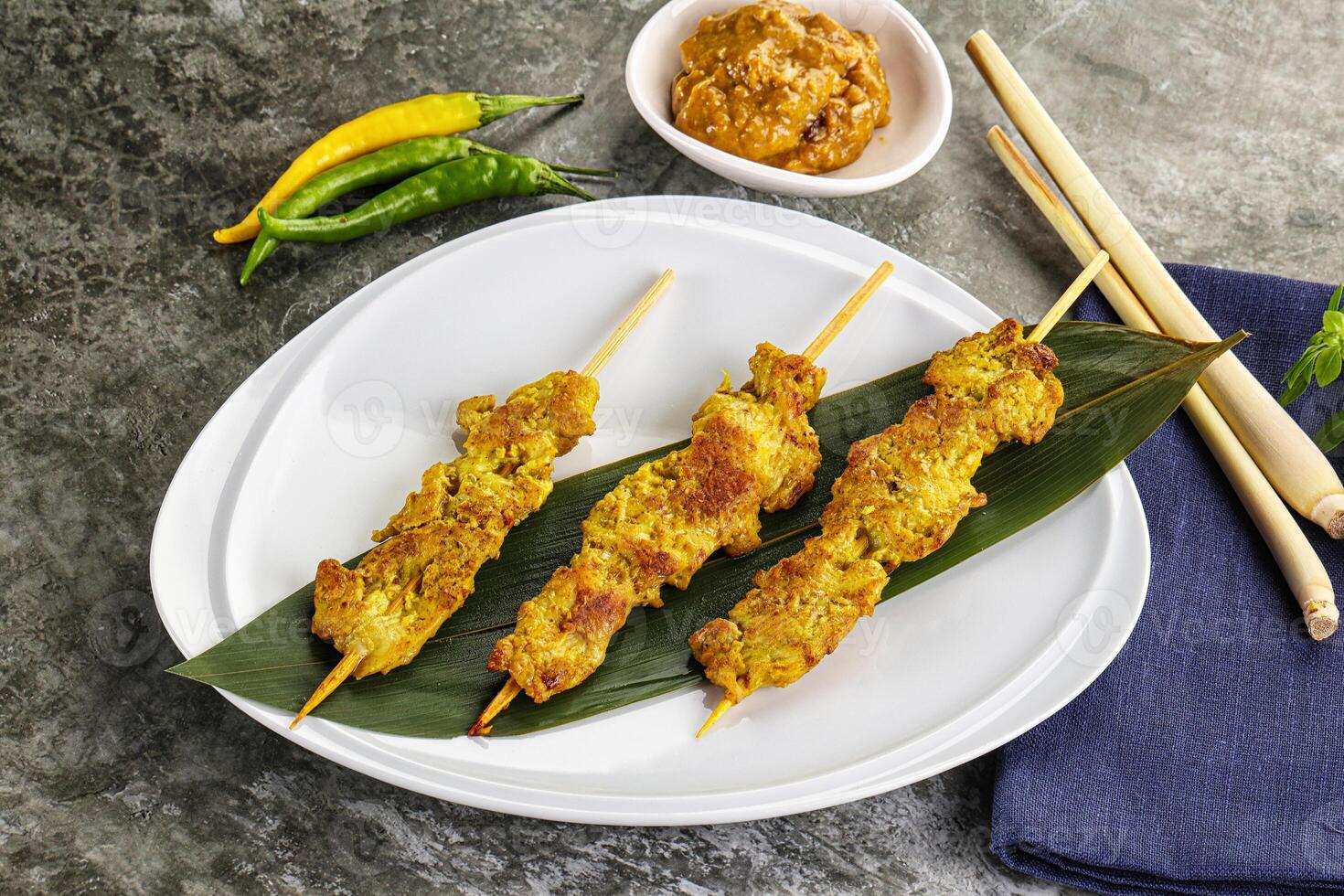 Thai meat skewer Satay with sauce photo