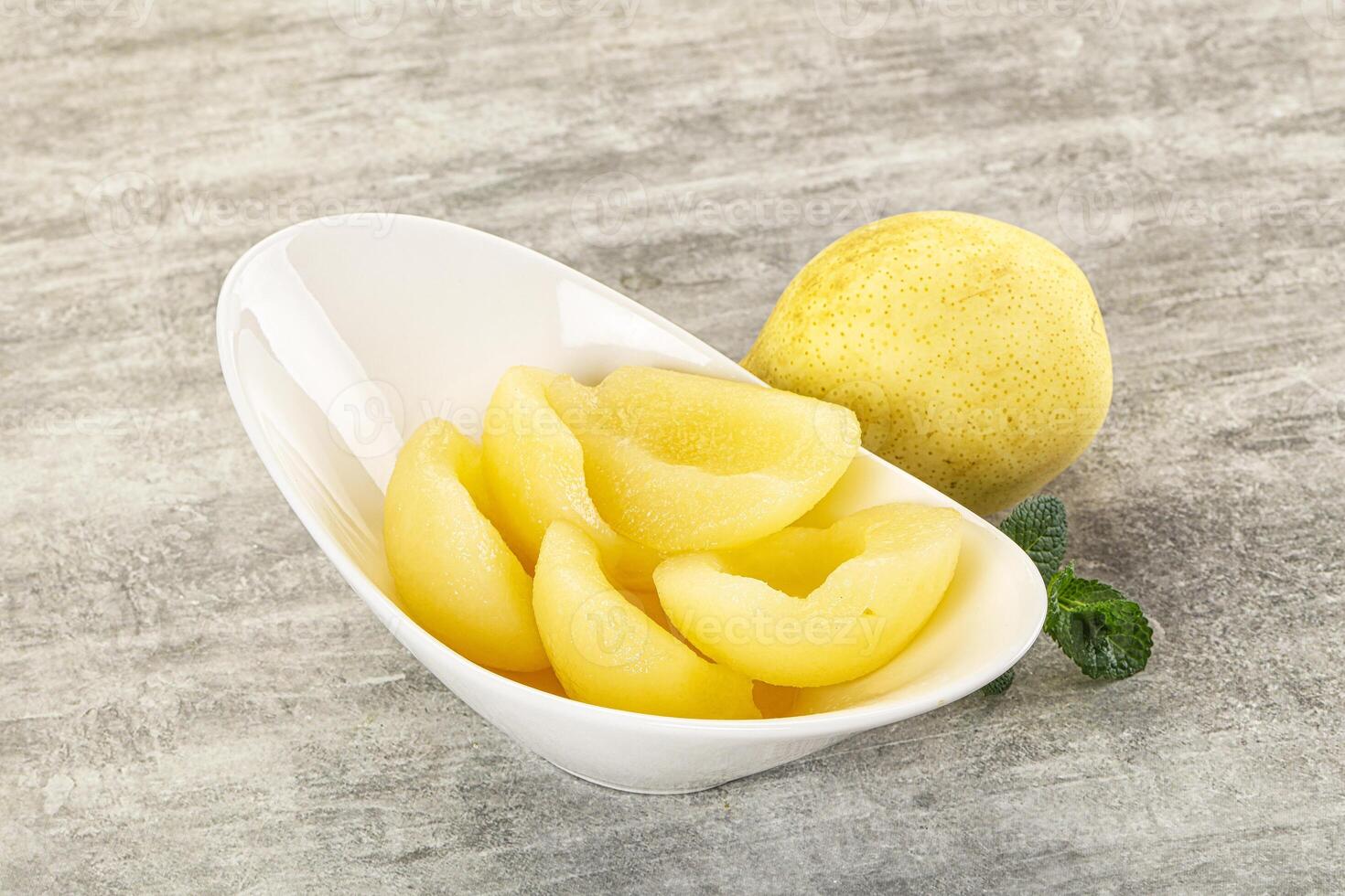 Canned yellow pear with syrup photo