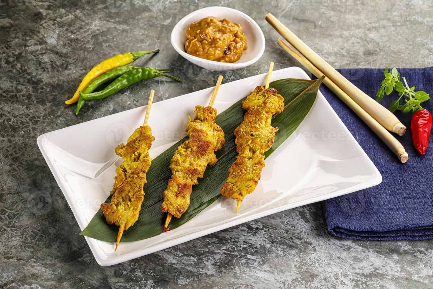 Thai meat skewer Satay with sauce photo