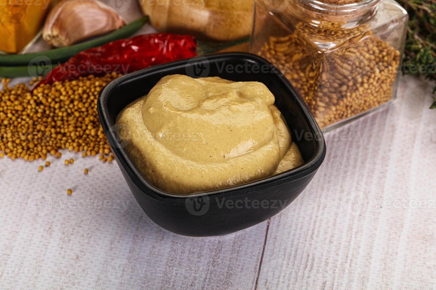 Dijon mustard sauce in the bowl photo