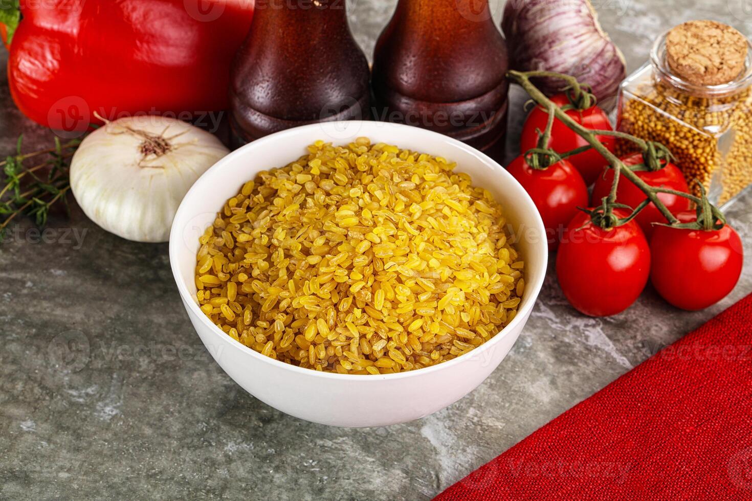 Dry wheat bulgur cereal heap photo