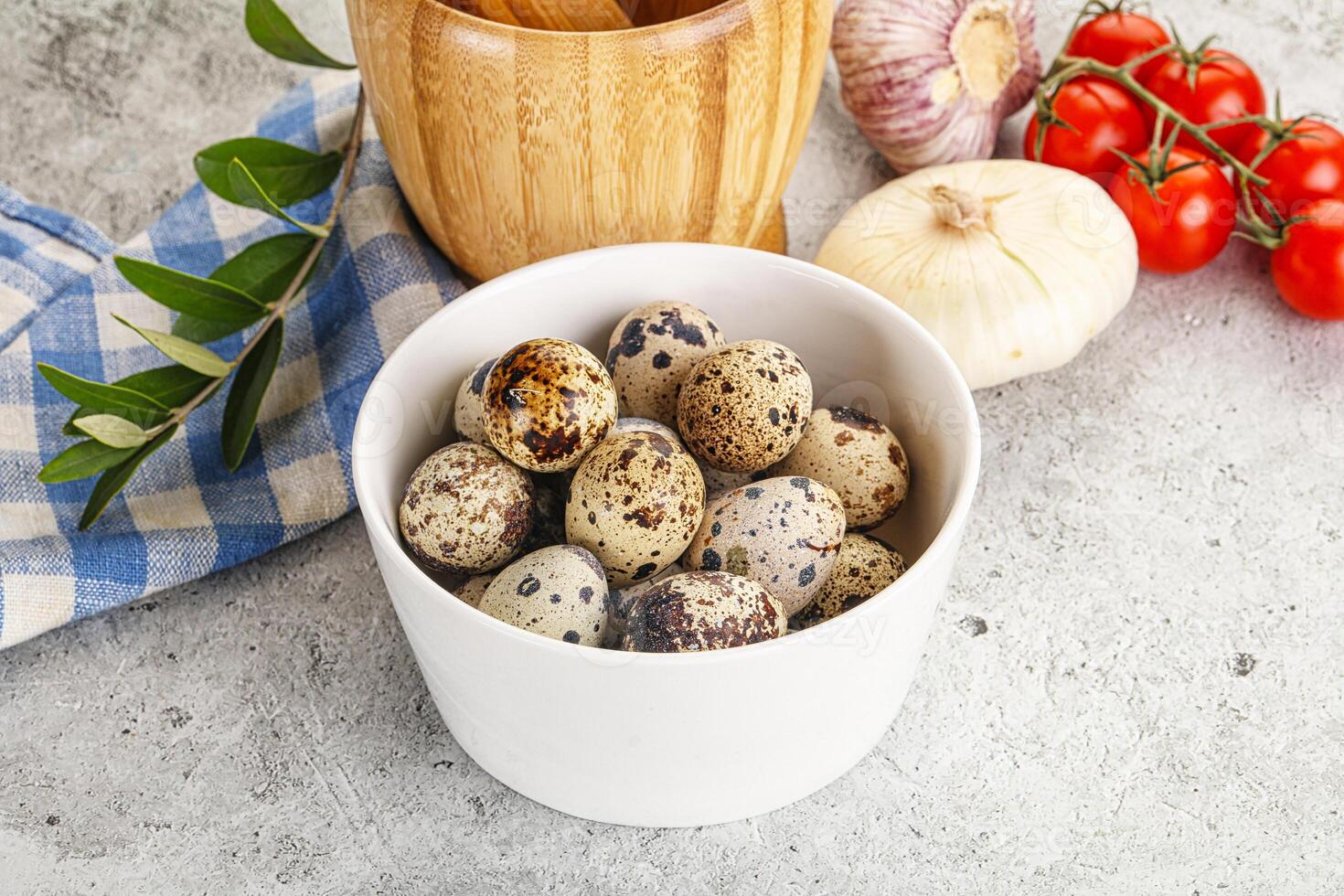 Raw quail eggs in the bowl photo