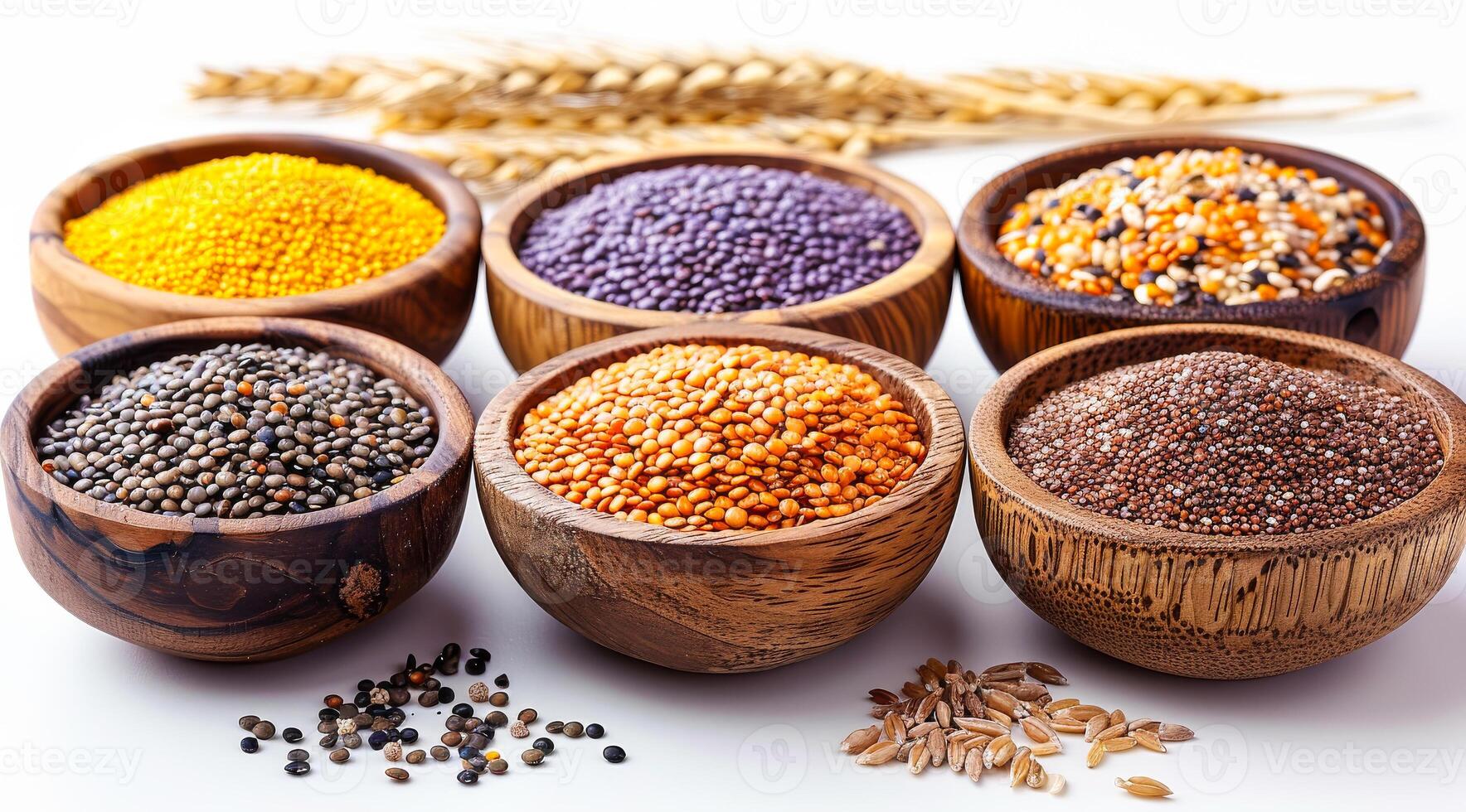 A variety of different colored beans are in wooden bowls. The bowls are arranged in a row, with some bowls containing more beans than others. The beans are of different colors, including yellow photo
