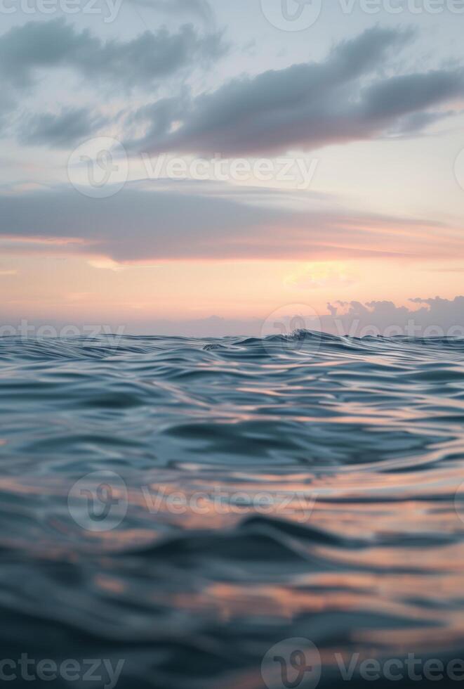 Crystal clear sea water at sunset photo