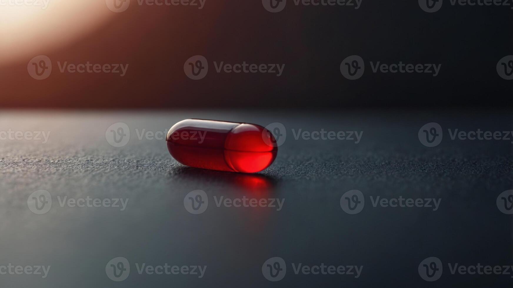 Close Up of a Red Pill on a Blurry Background. photo