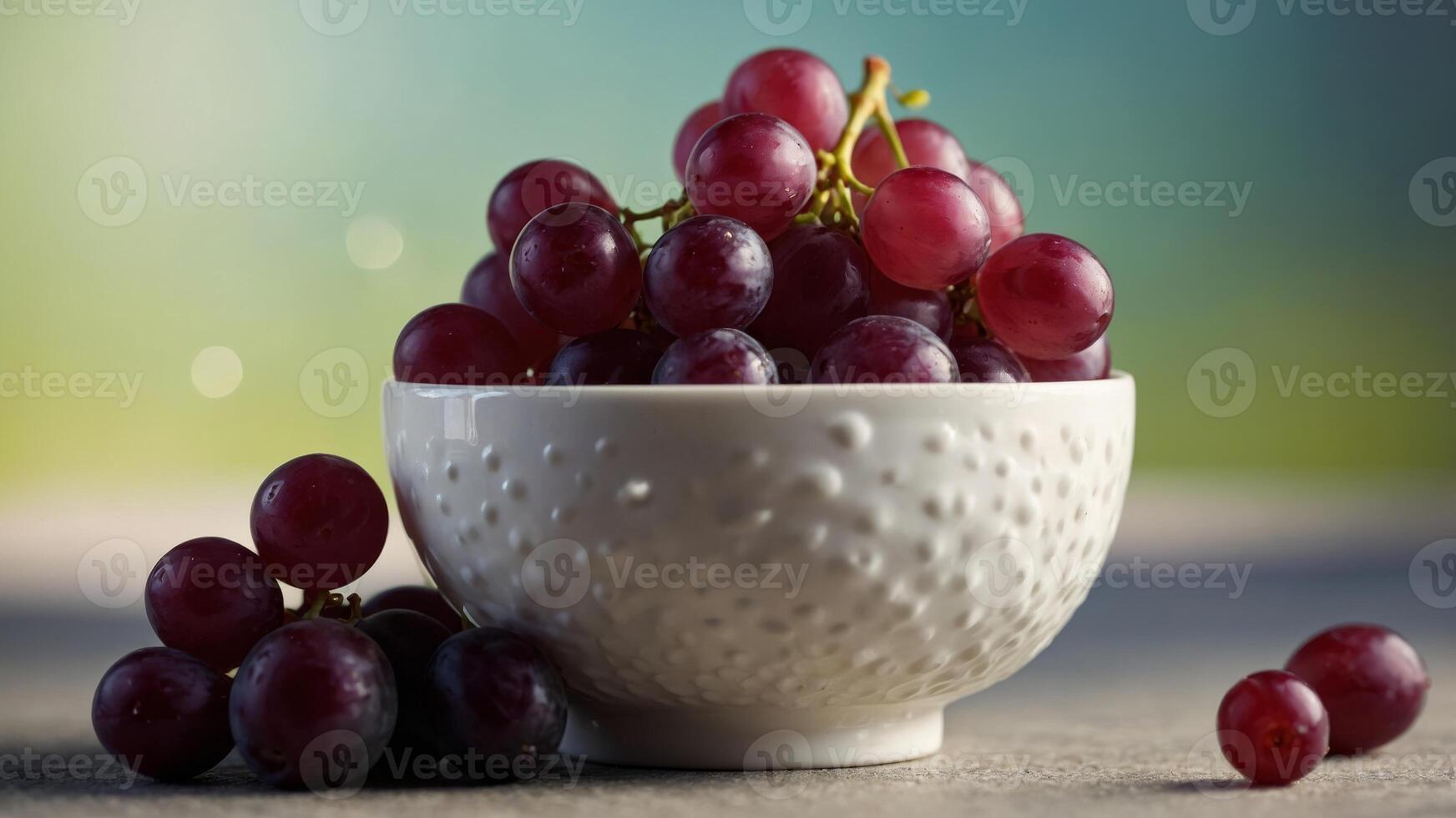 closeup of a dessert cup with fresh red grapes in it. photo