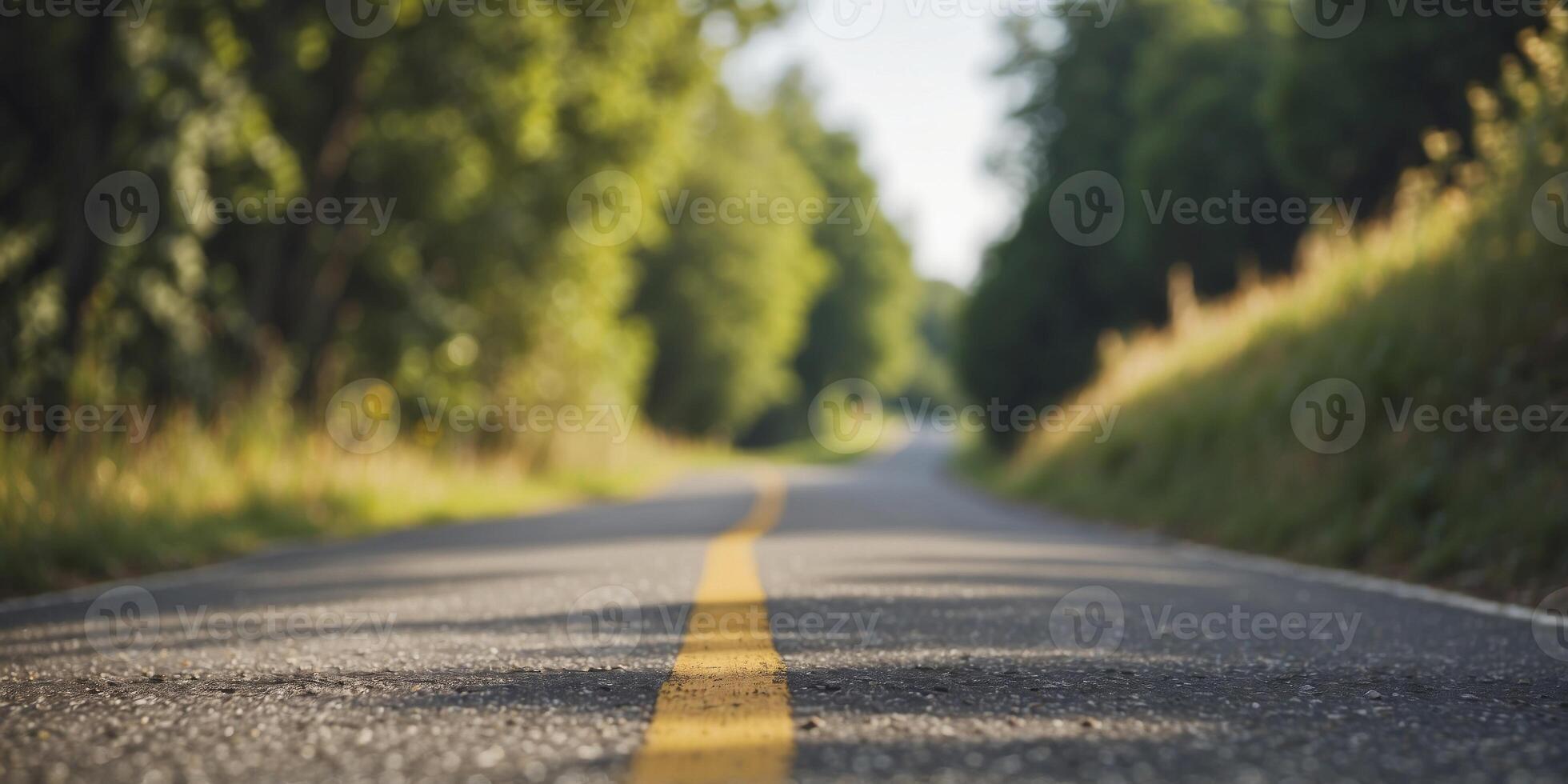 Asphalt road through a hilly area on a summer day. photo