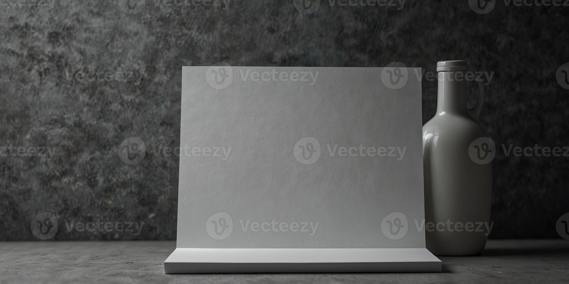 Gray background with copy space image of a blank sheet of paper. photo