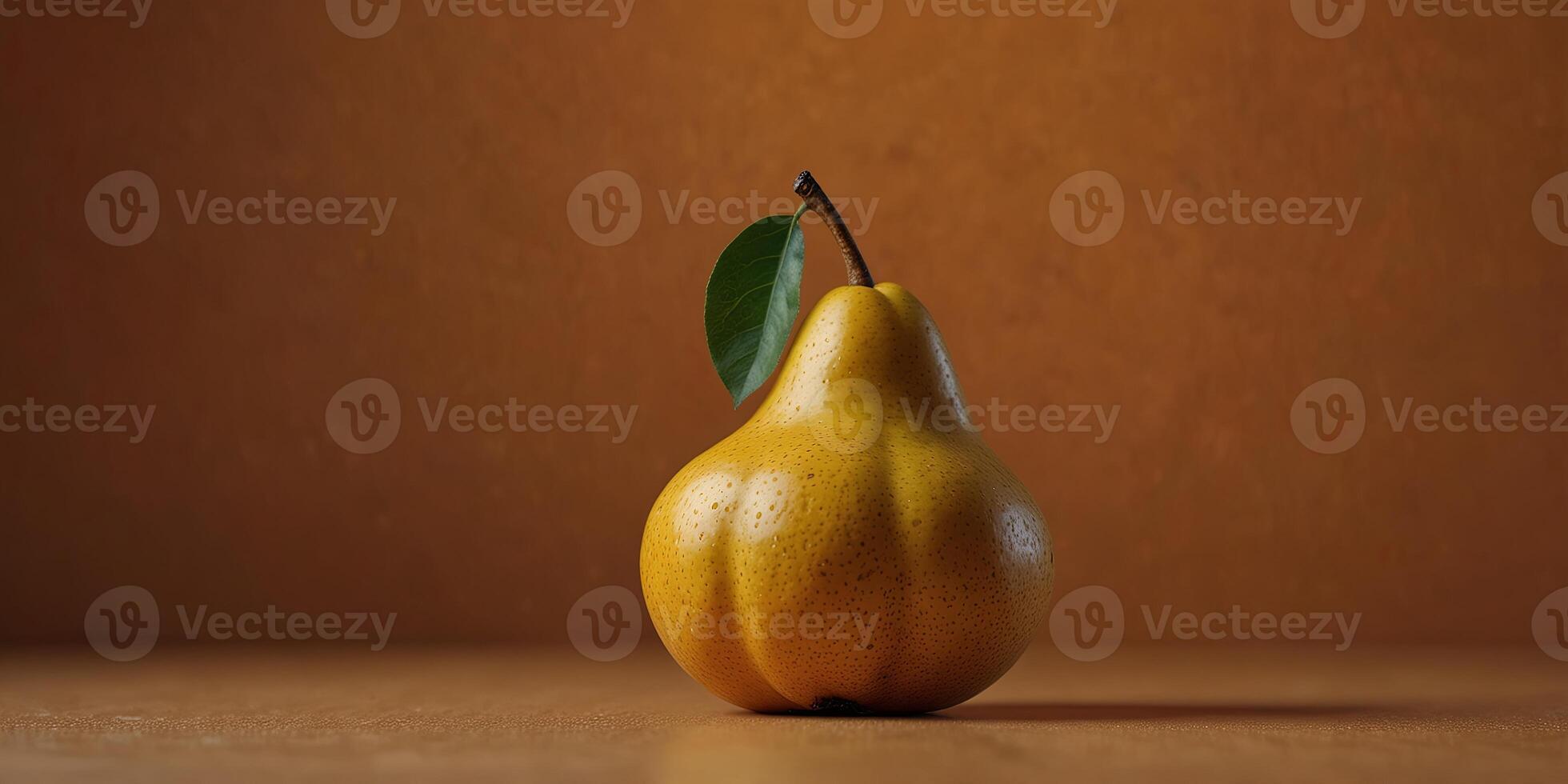 A ripe yellow pear on orange background, minimalistic still life, vibrant color. photo