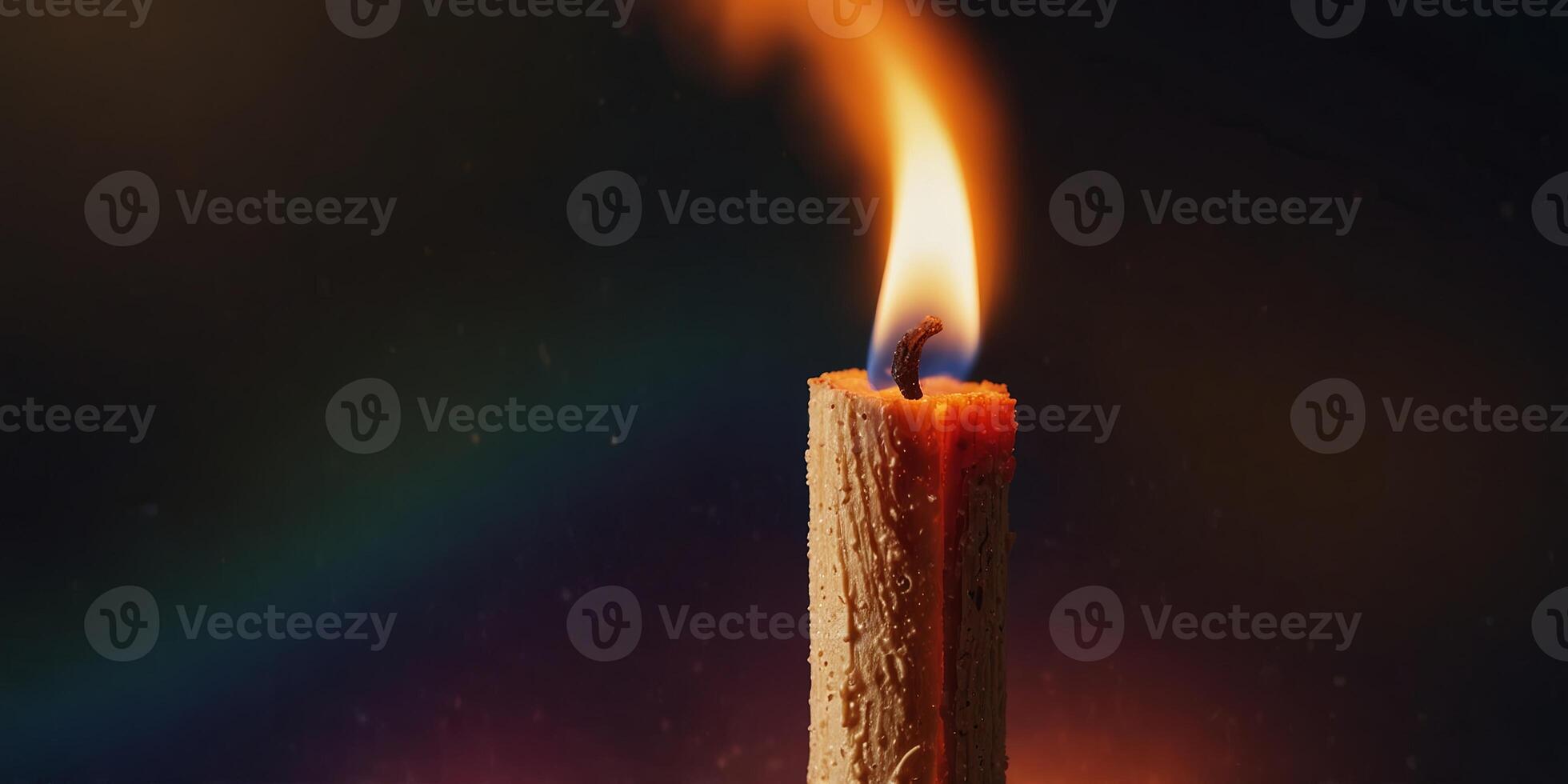 Close-up of a burning matchstick with vibrant colorful flames, abstract concept. photo
