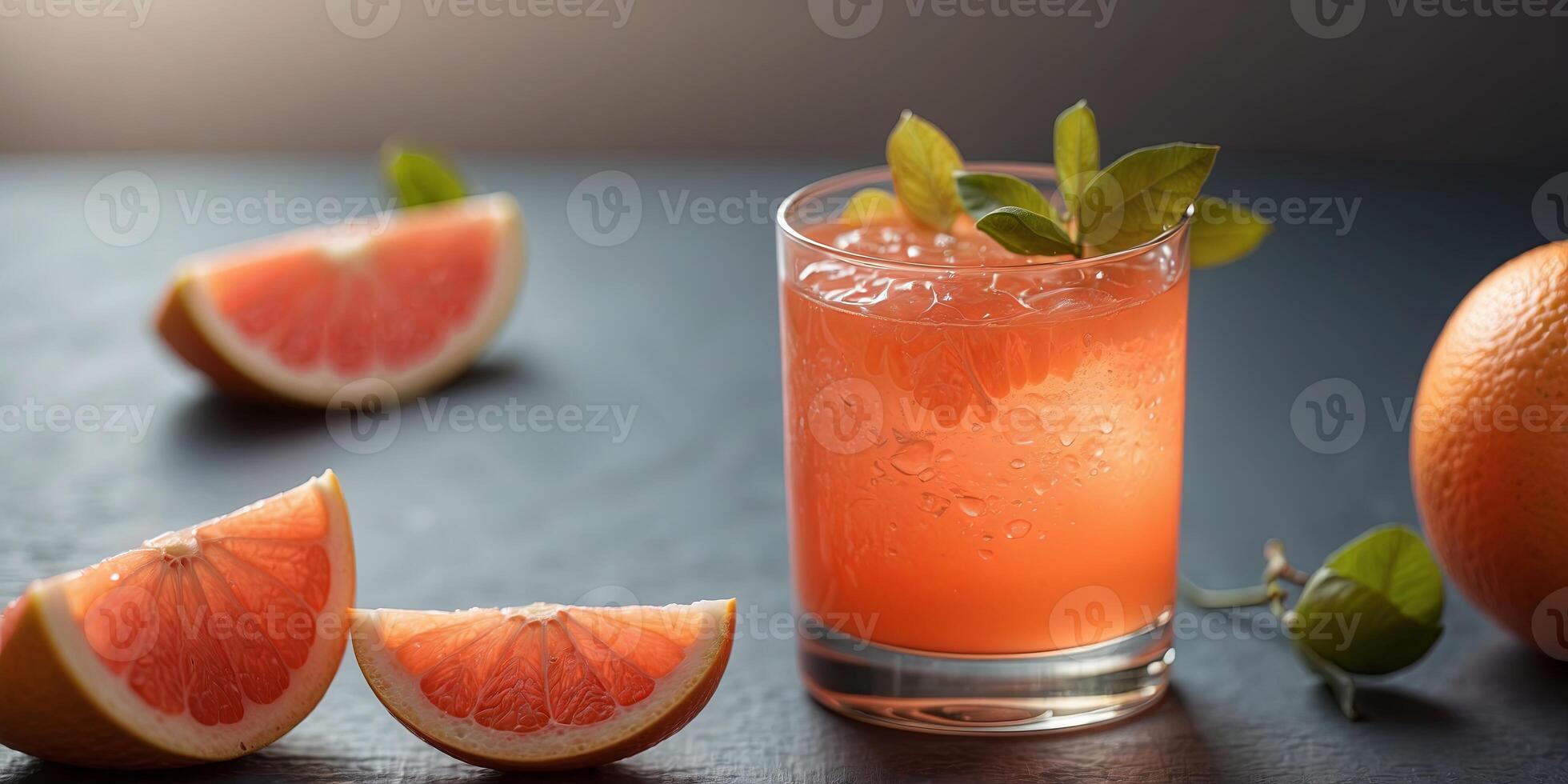Freshly squeezed grapefruit juice in a glass. photo
