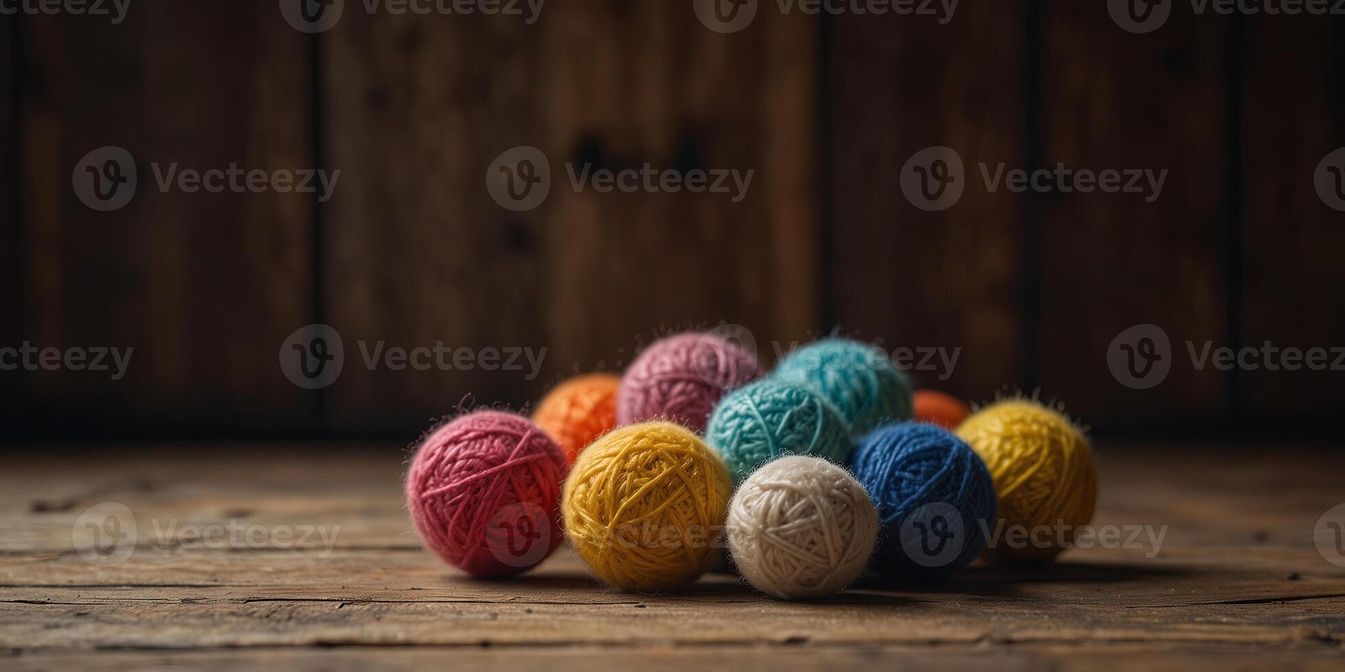 Rows of wool balls on weathered wooden table. photo