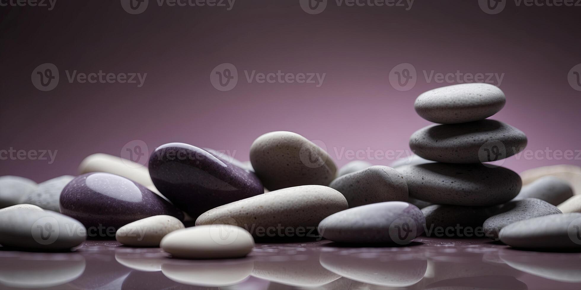 Stack of smooth stones on purple background. photo