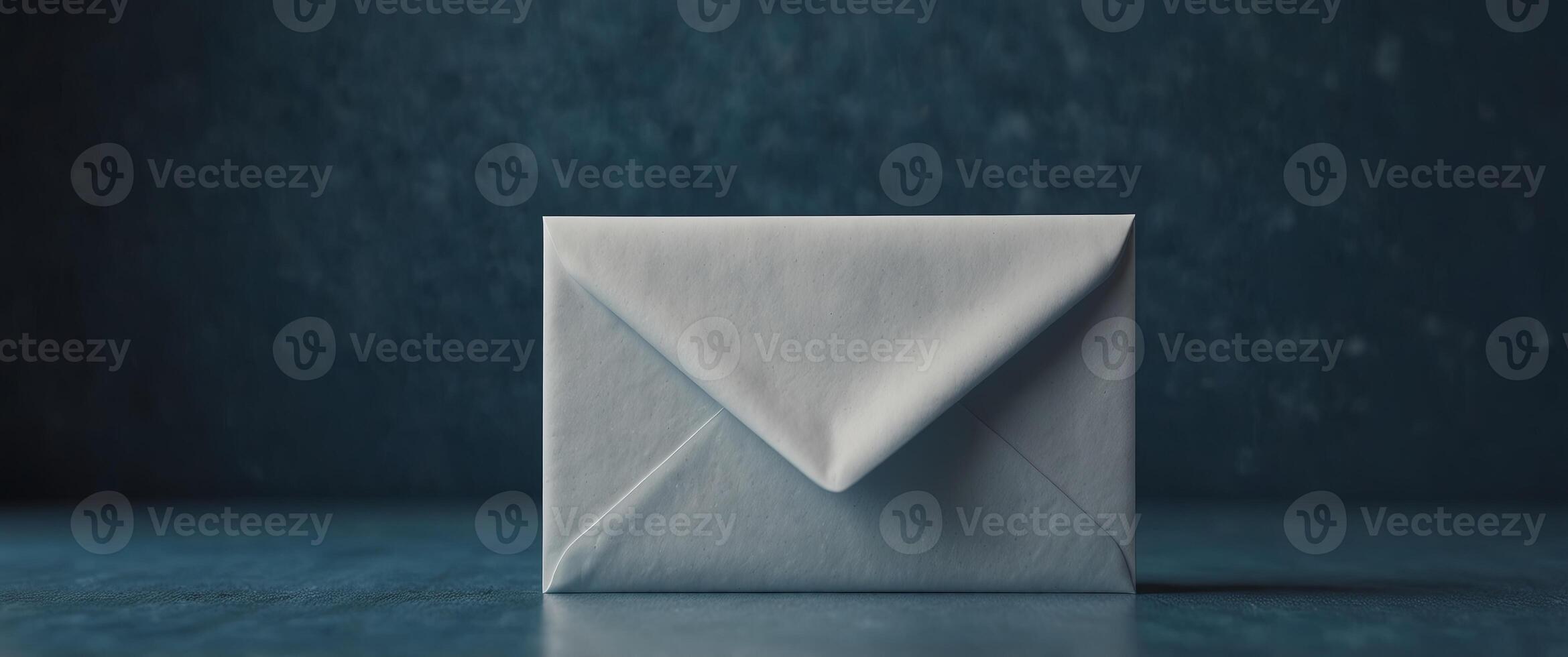 white and blank envelope on blue background with copy space. photo