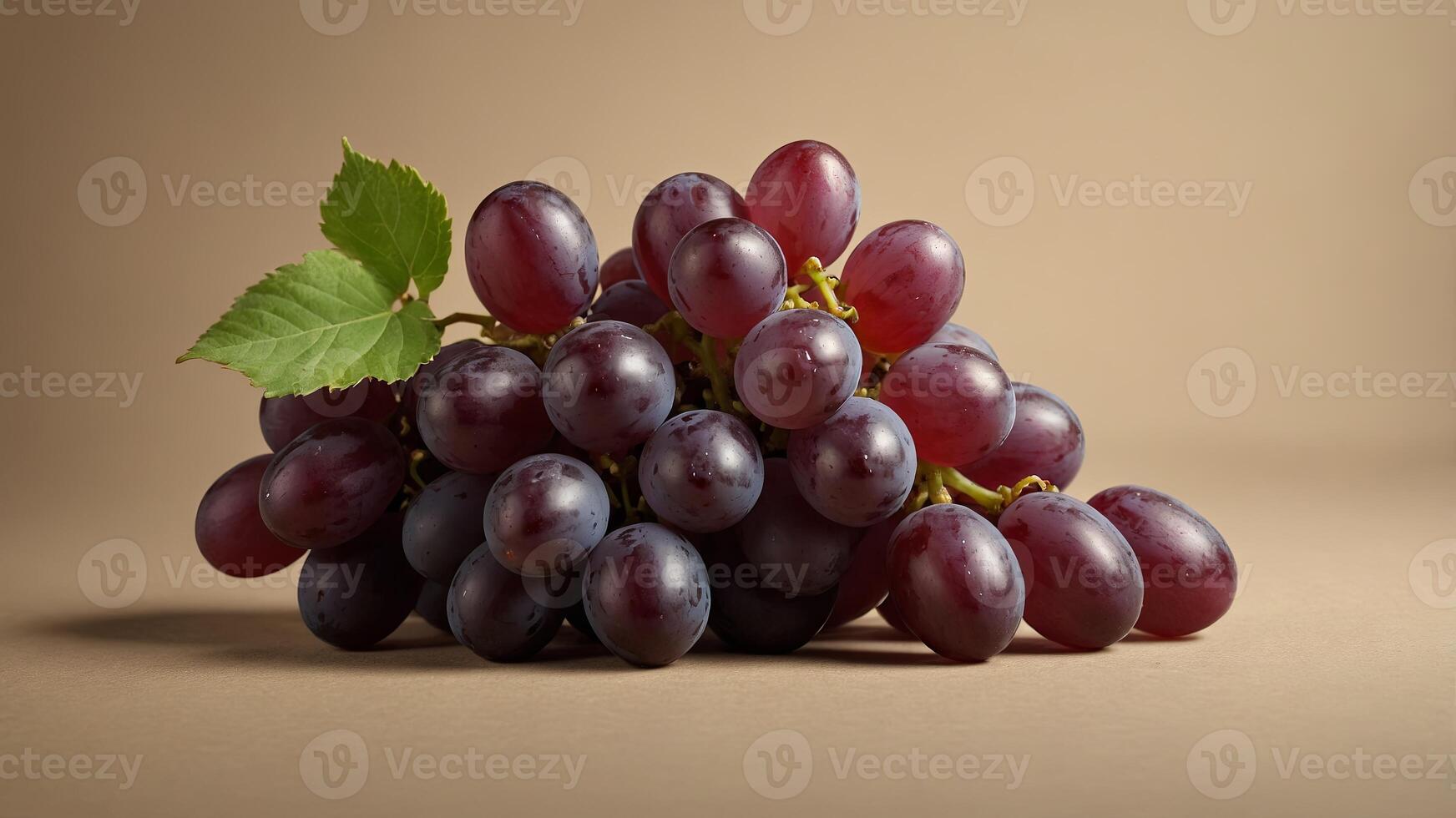 Red grapes on beige background, studio shot Food and nutrition concept. photo