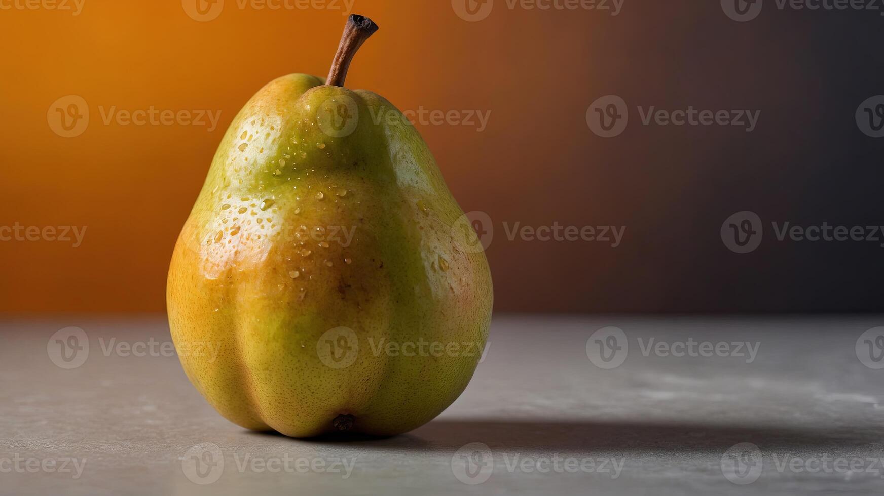 Ripe pear with orange gradient background. photo