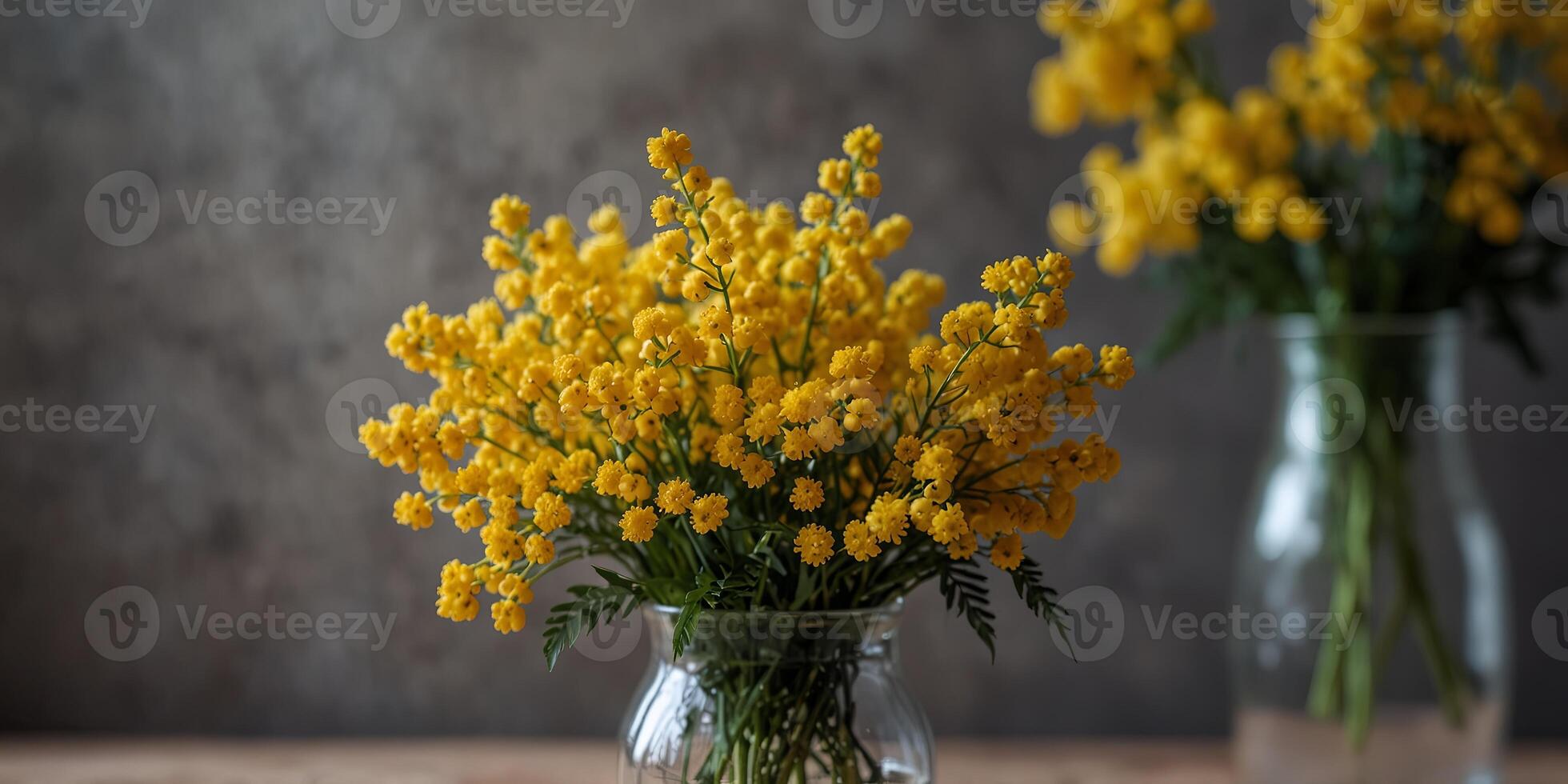 Yellow Mimosa blossoms arranged in a vase creating a beautiful spring bouquet. photo