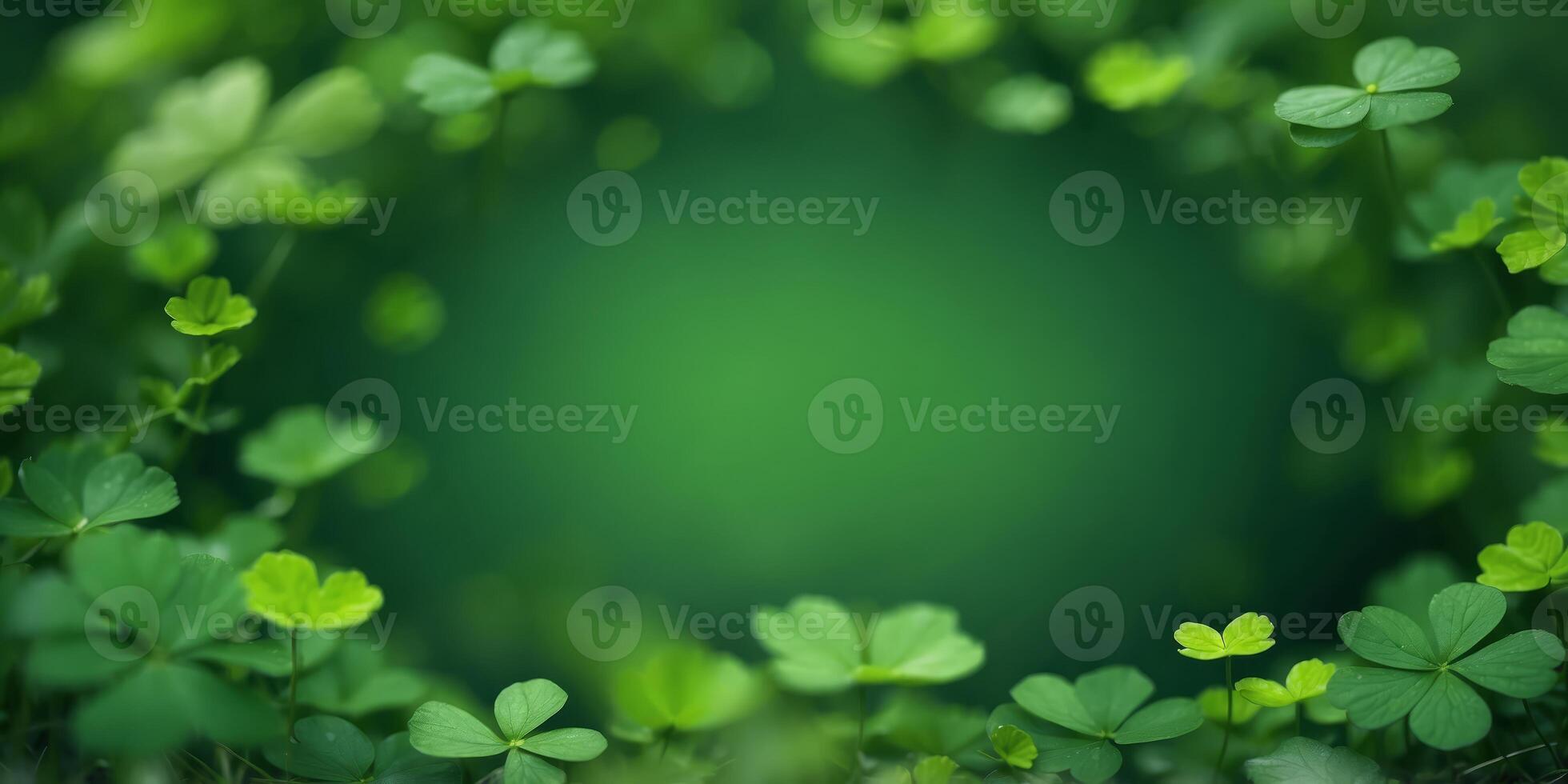 A circular green frame surrounded by a diverse array of clover leaves with varying shades of green,. photo