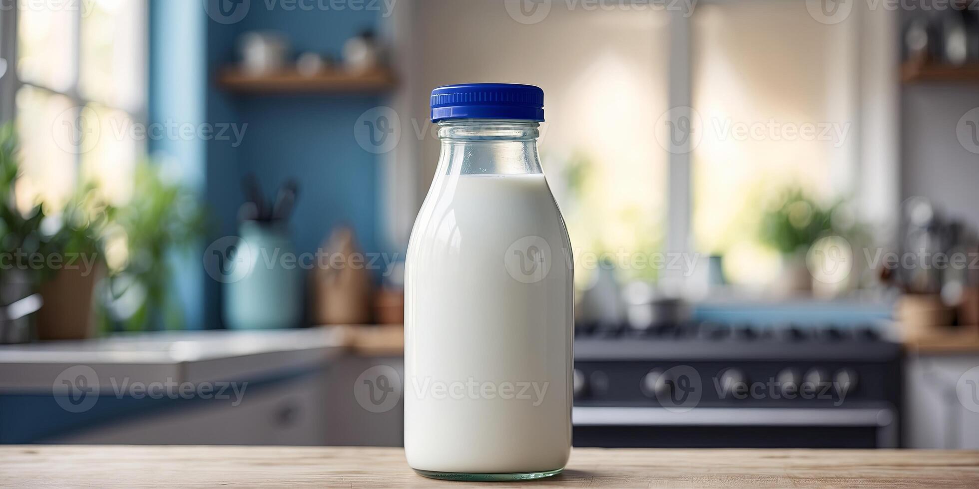 Milk bottle with a blue cap on a kitchen counter. photo
