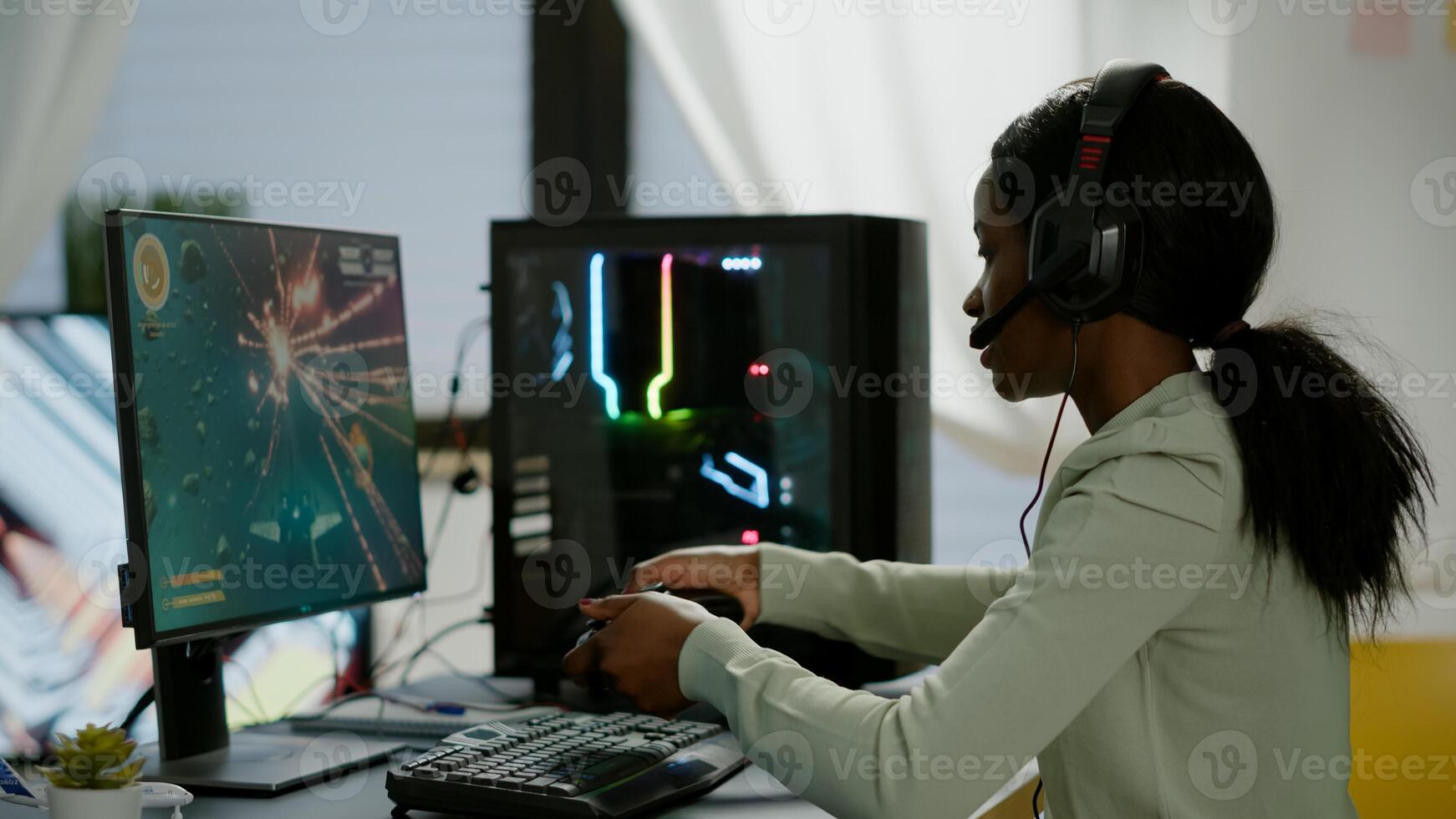 Upsed african woman gamer streaming online videogames and losing playing on RGB powerful computer using wireless controller. Player with headphones celebrating victory in gaming room photo