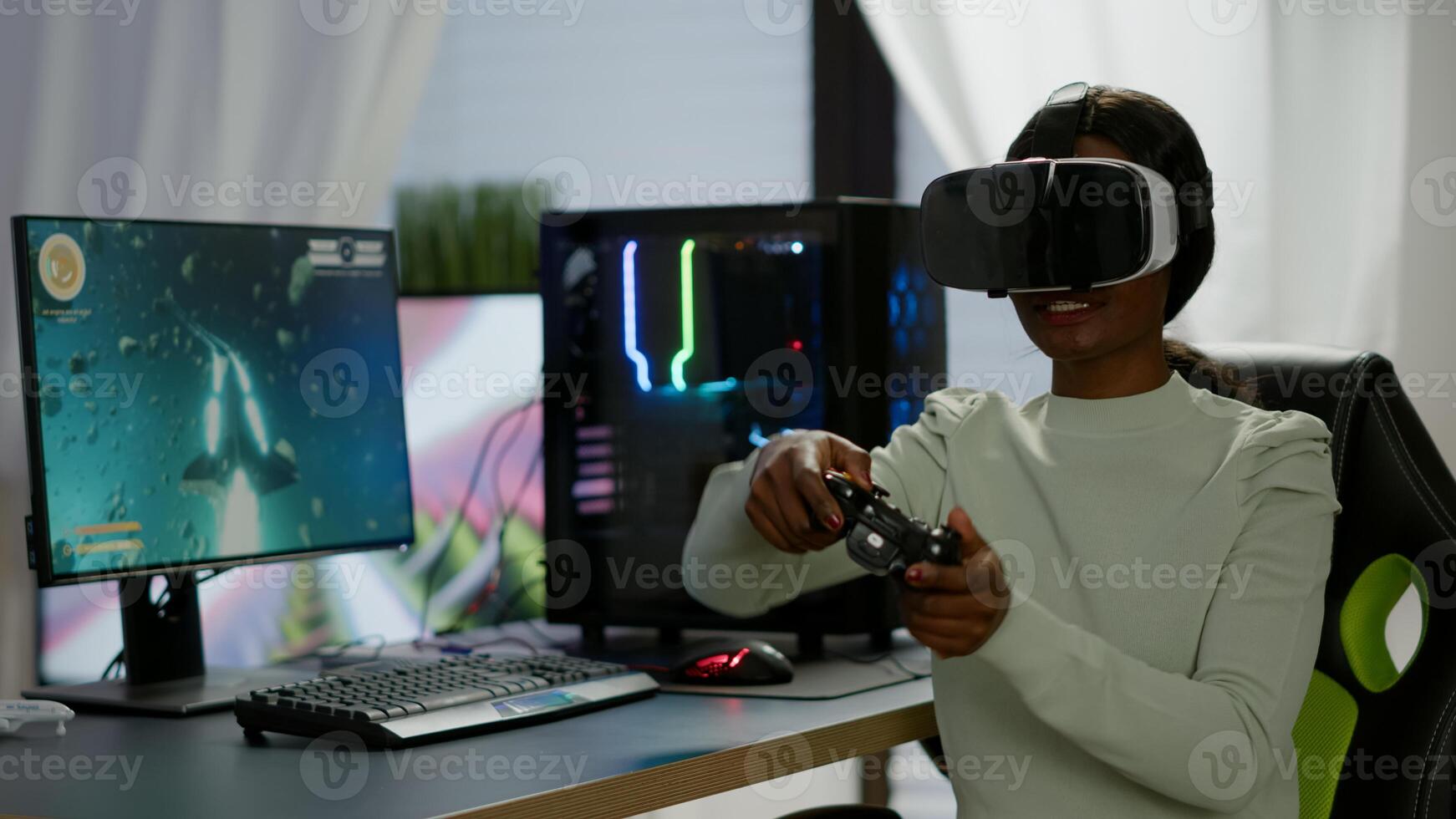 Winner player holding joystick playing videogame in gaming room using virtual reality. Professional pro gamer streaming online videogames with new graphics on powerful computer using modern equipment. photo