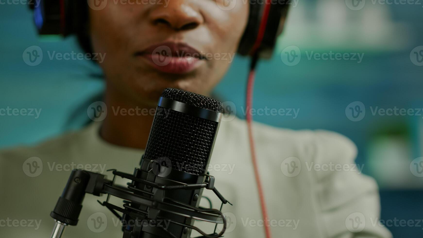 Close up of famous woman recording a vlog for subscribers using podcast microphone for vlogging. On-air online production internet broadcast show host streaming live content for social media photo