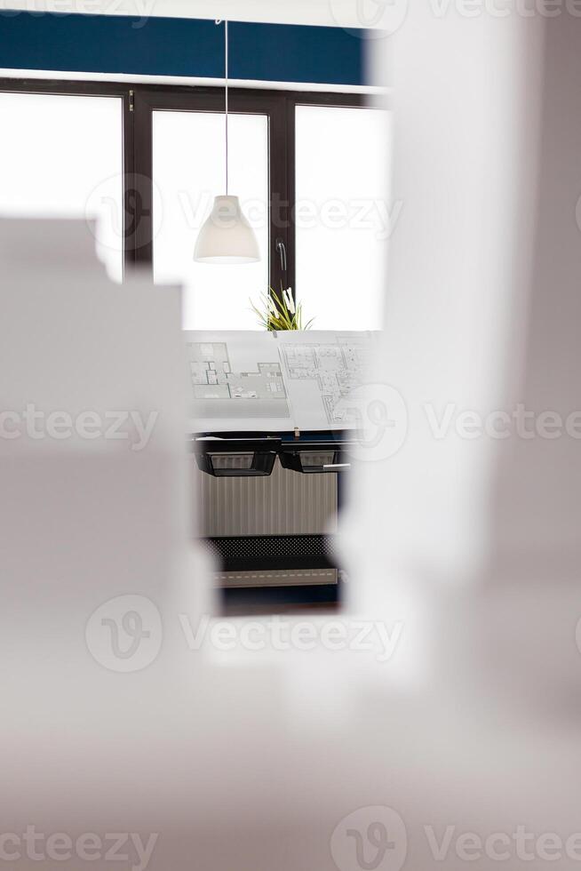 Architectural empty workplace for design business with equipment as blueprint models building plans notepad technology. Drawing of modern draft on copybook paper sketch table photo