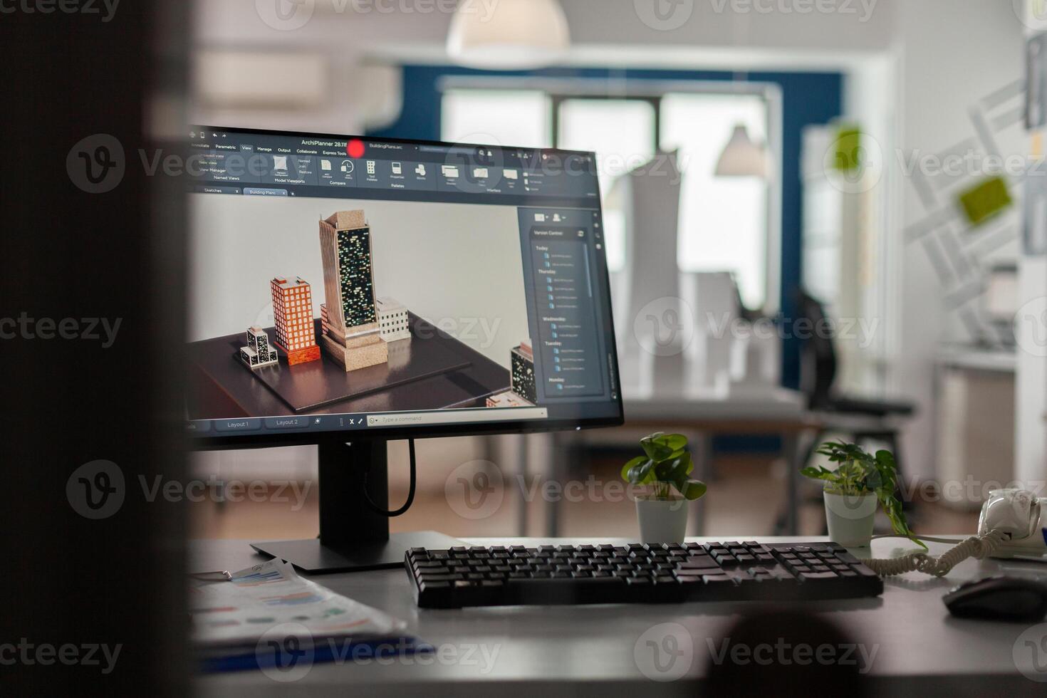 Desktop screen on architect desk showing model of urban planning architecture construction plans. Computer display with 3d render software of architectural building complex in modern office. photo