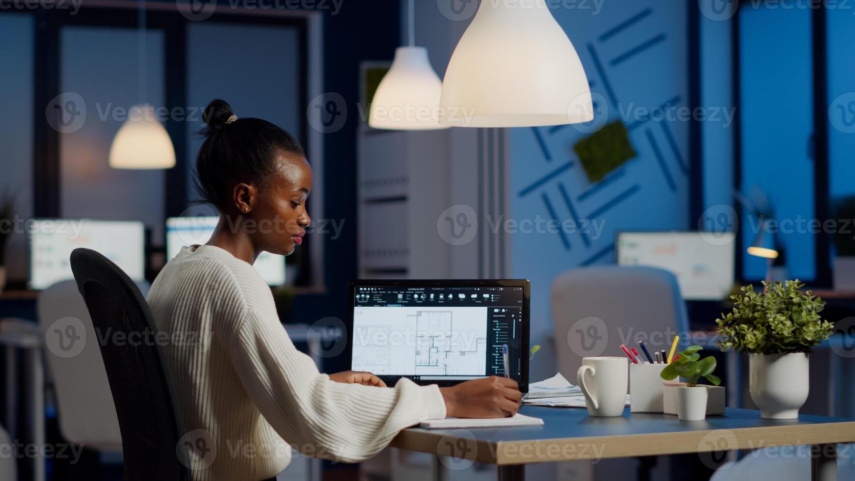 Engineer constructor designer architect creating new bluilding plan in CAD program working in business office. Industrial woman employee studying prototype idea showing cad software on device display photo