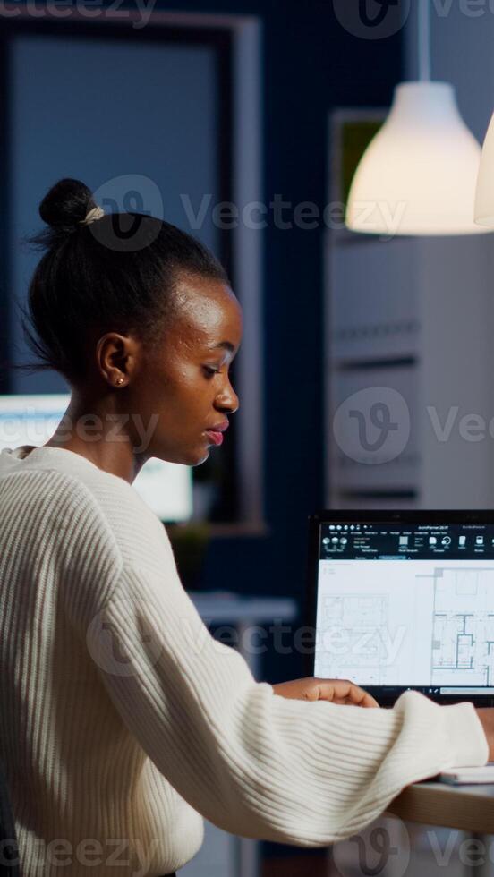Engineer constructor designer architect creating new bluilding plan in CAD program working in business office. Industrial woman employee studying prototype idea showing cad software on device display photo