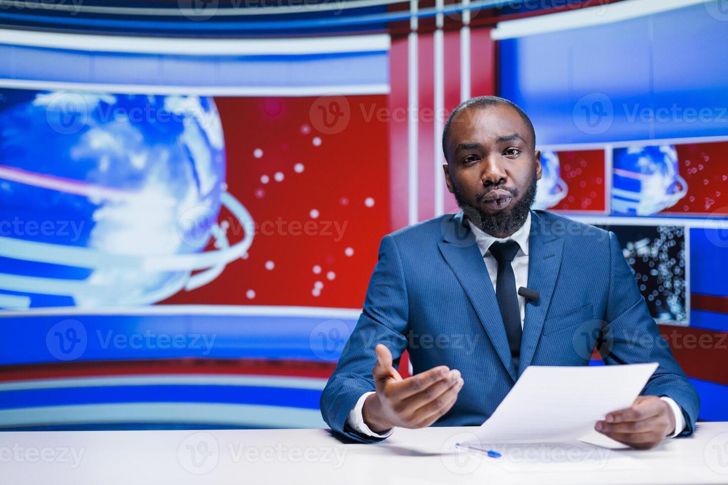 Anchorman reading news headlines from papers, presenting exclusive details about latest events worldwide. African american newscaster broadcasting politics or economics information, tv network. photo