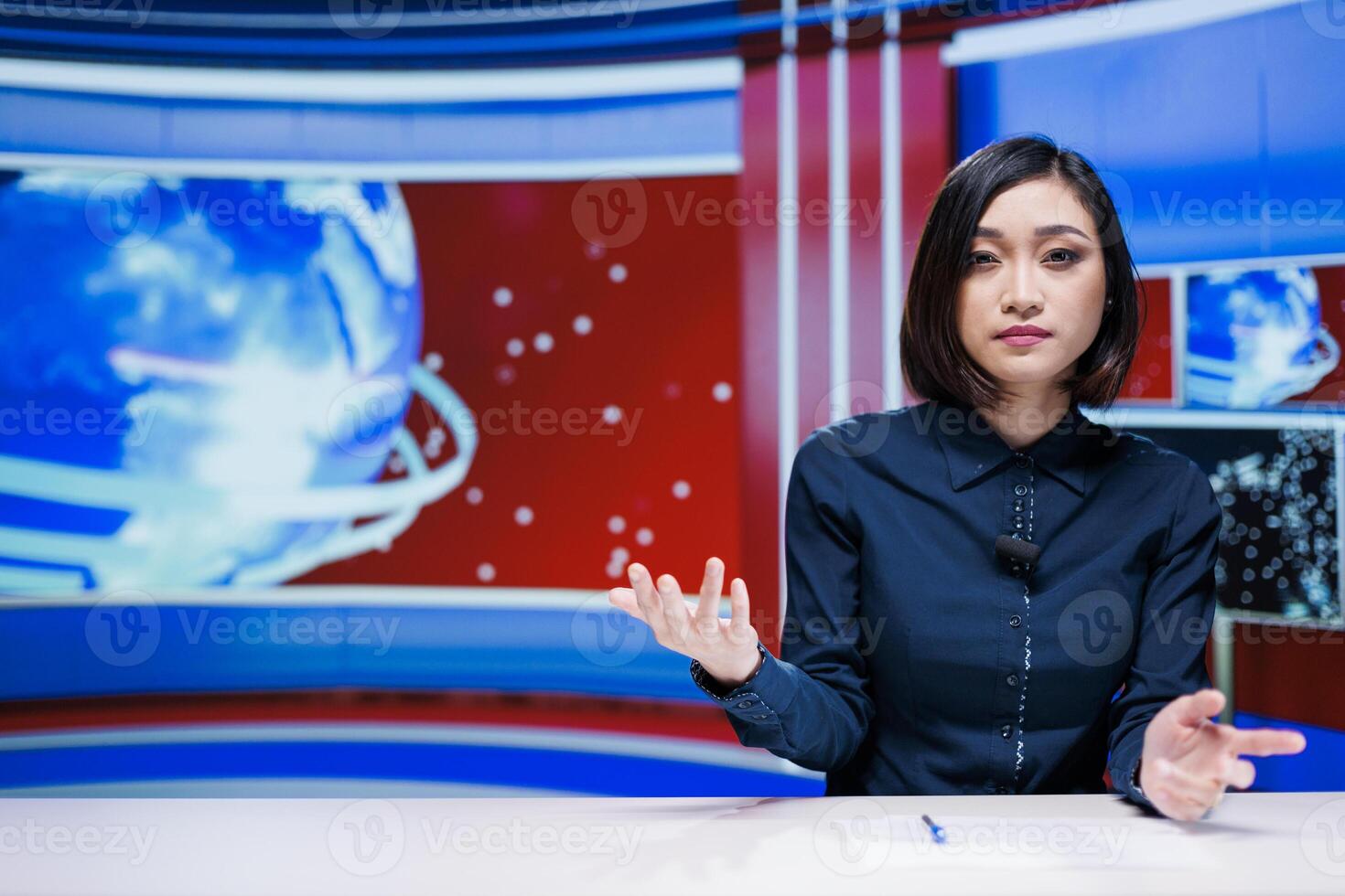 Asian host reporting live news on television broadcast, talking about daily events in newsroom. Woman journalist giving insight on latest topics, creating media television content. photo