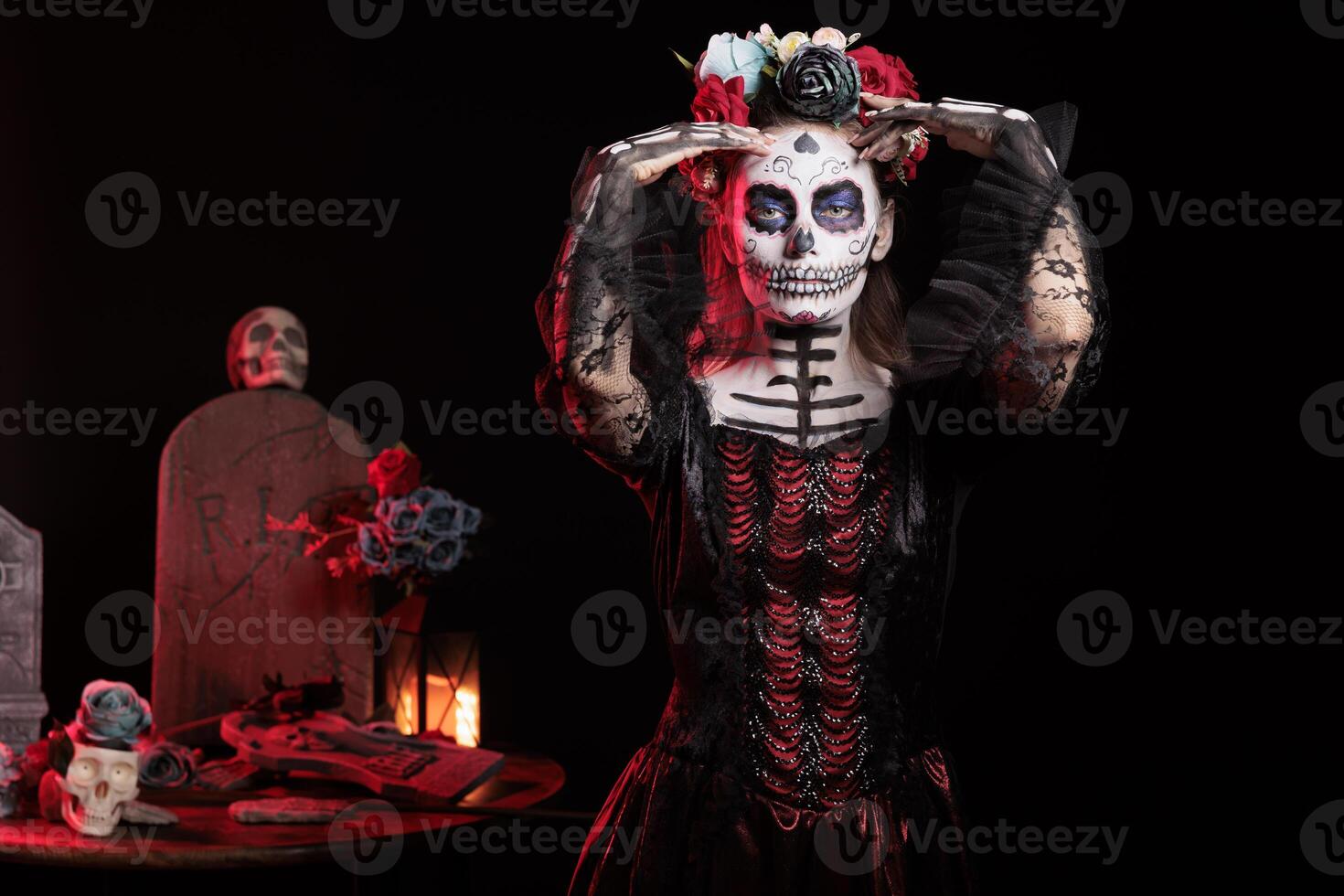 Portrait of happy woman wearing suit during D a de los Muertos Halloween event honoring dead loved ones. Cryptic lady doing occult ancient Aztec custom of celebrating ancestors photo