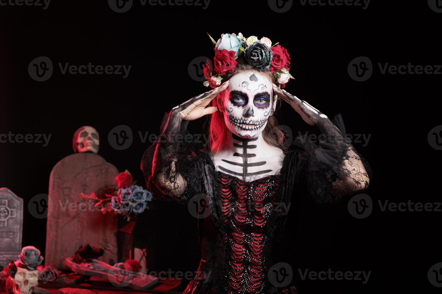 Woman participating at Dia de los Muertos event, preserving and passing down cultural traditions from one generation to the next. Lady wearing la Catrina costume to celebrate Mexican culture photo