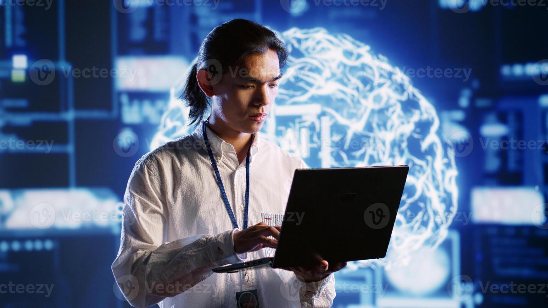 Portrait of smiling specialist using laptop to maintenance artificial intelligence neural networks made up of interconnected nodes. Happy computer operator updates AI system processing information photo