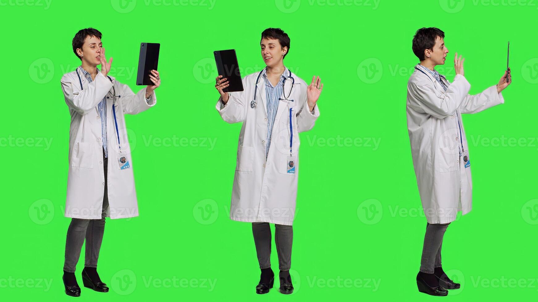Woman specialist chatting with patients on online videocall connection, waving at tablet webcam and doing telemedicine consultation. Medic meeting with people on internet conference. Camera A. photo