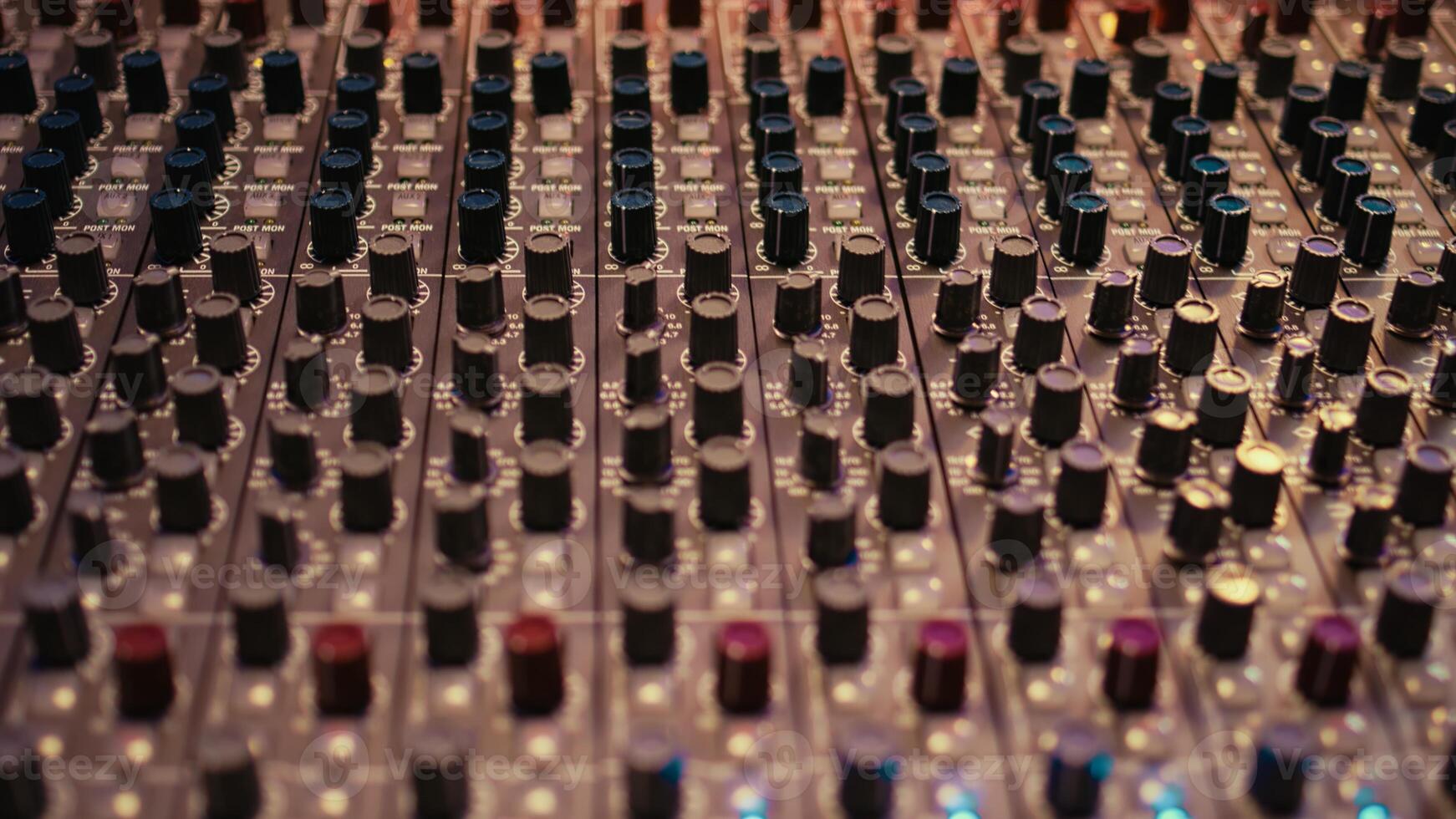 Control room panel board with buttons and switchers serve as mechanical and technical equipment of recording and mixing sound. Empty professional soundproof music studio. photo