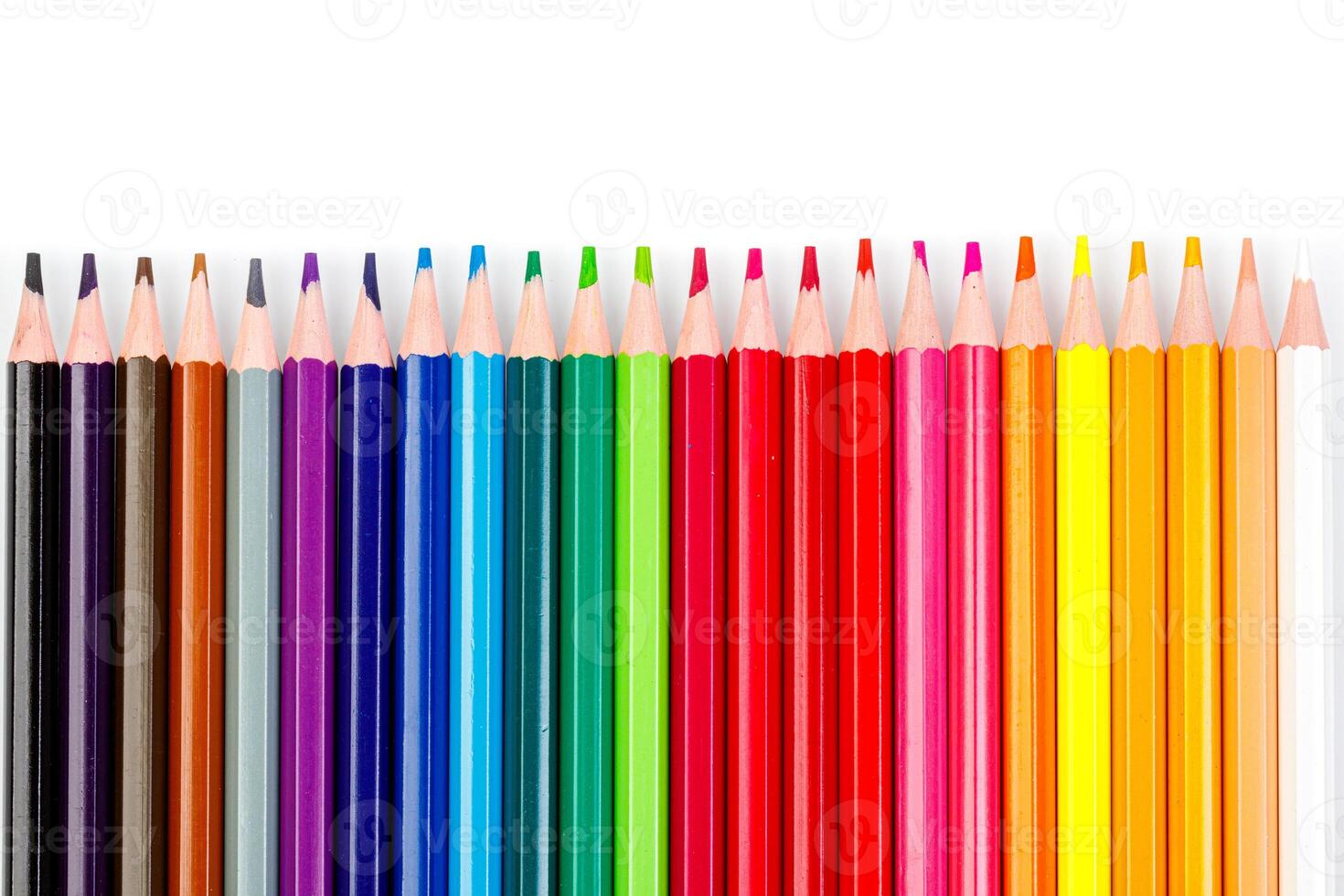 macro multicolored pencils on a white background photo