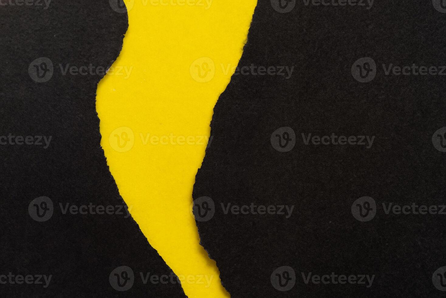 Yellow Background with Torn Black Paper photo